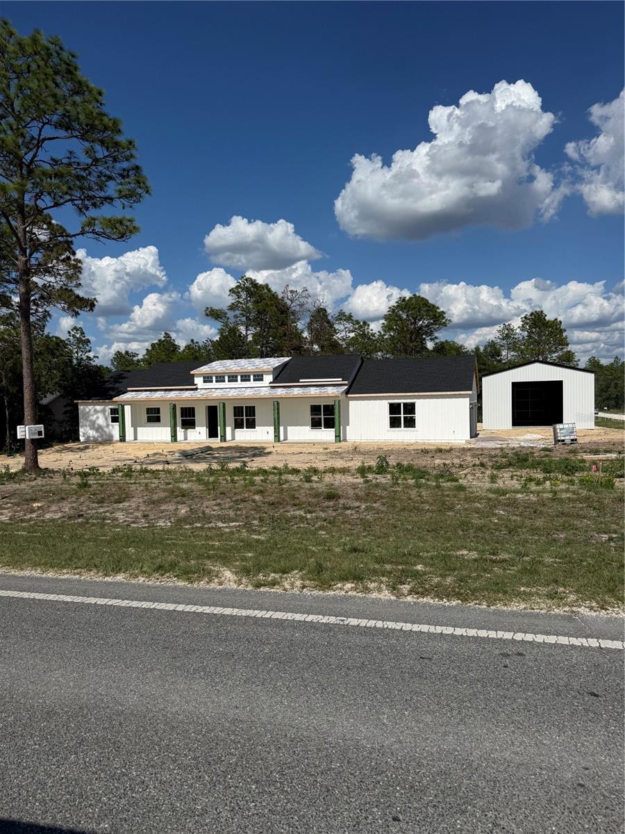 Under Construction. Custom-Built. Acre-Plus. Shop Big Enough to Actually Use.
This isn’t a builder-grade box dropped on a lot. It’s a true custom build by Brije Custom Homes, 2025 Builder of the Year and Featured Builder for the 2026 Parade of Homes. Four bedrooms, three full baths, sitting on more than an acre with room to breathe and zero HOA babysitting your weekend projects.
The split-bedroom layout puts the primary suite on its own end of the home with a designer-curated bath and walk-in closet built for the way people actually live. The kitchen opens straight into the great room under a clerestory ceiling that pulls in natural light from every angle, the kind of detail that doesn’t happen by accident.
Now the garage situation. Three-car attached garage for the daily drivers. Then walk out back to a 50x30 detached shop with a 14-foot garage door, which translates to: park the RV, pull in the boat, build the woodshop, run the side business, store the toys. Whatever your version of “finally have the space for it” looks like, this is it.
Every Brije build runs through our in-house designer, so the finishes, fixtures, and flow are intentional from day one. No cookie-cutter selections, no contractor-grade compromises.
Properties with this much usable acreage, this level of build quality, and a shop this size don’t sit long in Marion County. SAVE MONEY NO HOA.  Pictures will be updated when homes is complete. Dont wait come and see it today!