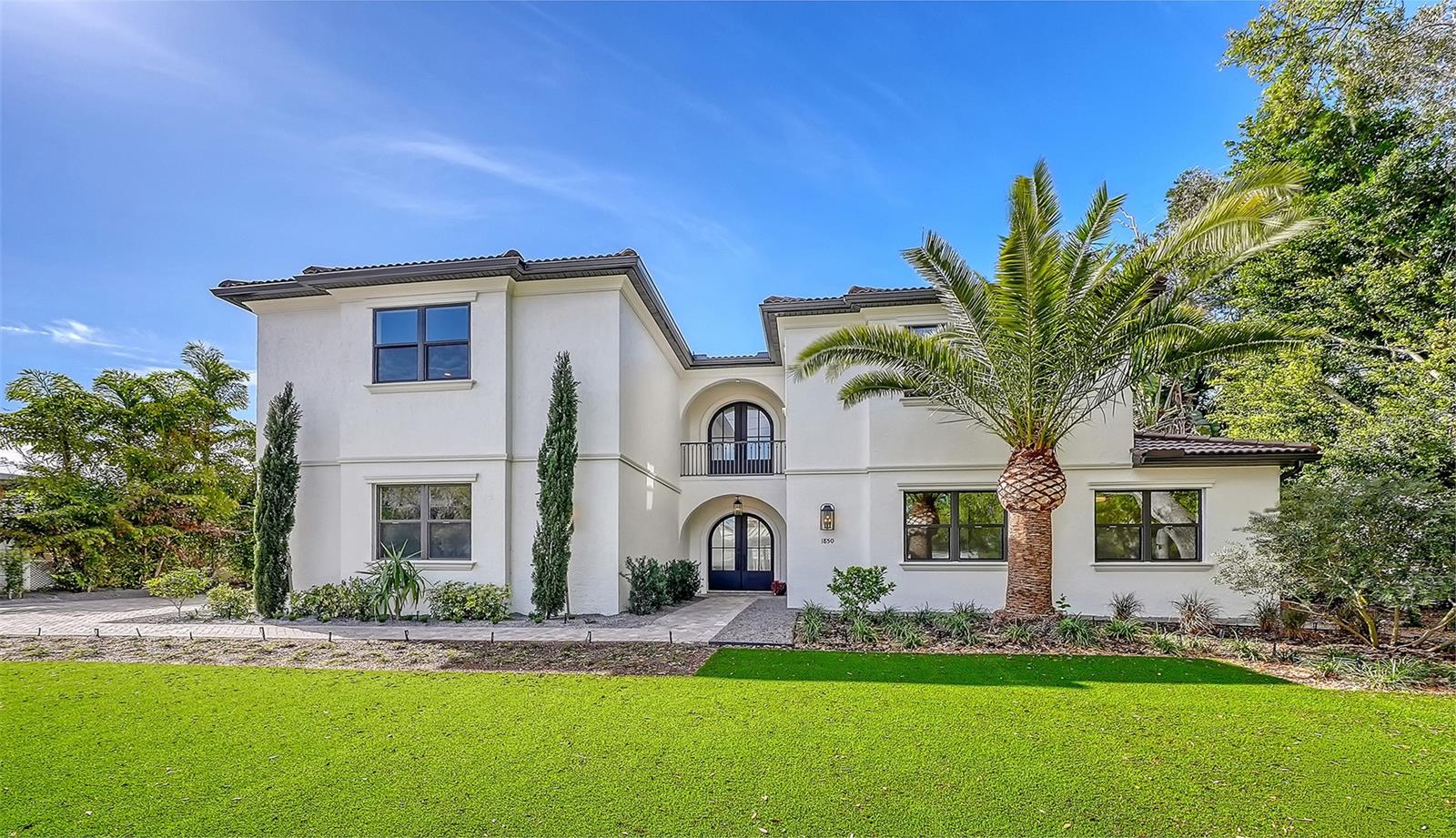 Virtually Staged. West of trail, 2026 Custom Build, Exquisite Modern Mediterranean estate with a seamless blend of classic architecture and contemporary finishes. 

This exceptional 5-bedroom, 4-bathroom residence is thoughtfully designed for both everyday living and effortless entertaining. The main level features a luxurious first-floor primary suite with a walk-in closet and spa-inspired bathroom with dual vanities, along with two first-floor guest bedrooms and a private office. Wide-plank oak hardwood floors, custom built-ins and maple wood cabinetry with inset doors , and a warm, inviting electric fireplace enhance the home’s elegant yet comfortable ambiance. A fully integrated surround sound system extends throughout the living room, kitchen, and outdoor entertaining areas.

The chef’s kitchen is beautifully appointed with premium Viking appliances, Taj Mahal quartzite countertops, custom cabinetry, elevated fixtures and designer lighting, along with a stylish bar featuring Cristallo quartzite and a beverage center—perfect for hosting and entertaining.

The second level offers a spacious bonus room ideal for a media lounge or game room, along with two additional bedrooms and a gallery-style hallway with an open balcony, adding architectural interest and natural light.

Additional highlights include natural gas, a gas-on-demand water heater, enhanced exterior insulation for energy efficiency, a concrete tile roof, irrigation system, and abundant storage throughout.

Architecturally, the home embraces classic Mediterranean elements with a modern sensibility. Arched doorways, windows, and passageways create a sense of flow and understated grandeur, while intricate wrought iron detailing and extensive millwork add depth and craftsmanship. Statement chandeliers and curated designer lighting elevate each space, enhancing the home’s refined aesthetic.

A detached guest home, complete with a private bedroom, full bathroom, and living area, offers ideal accommodations for guests or extended stays.

Outdoors, a custom-designed oversized pool showcases timeless Mediterranean blue tile, complemented by elegant fire bowls and a cascading waterfall spa—creating a true resort-style setting. The property is complete with a 2-car attached garage in the main home, 2 car covered parking under the guesthouse, and an additional two-car garage, offering both functionality and flexibility.

Ideally situated in Southside Village, this residence offers a highly walkable lifestyle just moments from Southside Elementary, Morton's Gourmet Market, local restaurants, and boutique shopping.
