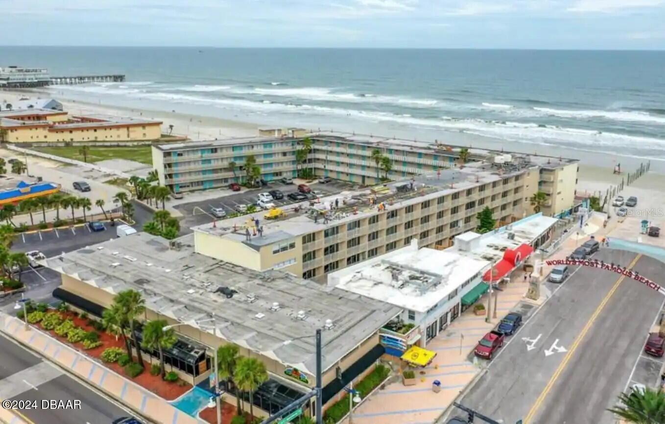 Beachfront Condotel with no rental restrictions. Animal friendly property. Rent it out or have your own beach escape. Strong six year rental history with average of 20k annually income when renting short term. New inside paint and under the sea decor. ALL assessments are paid in full! There are no further knowledge of assessments. New roof, new pool, pool showers, new seawall, new drainage system, newly paved parking lot, new building concrete restoration, funded reserves, and milestone inspection passed. HOA includes electric, water, sewer, trash, grounds and pool maintenance, monthly pest control, insurance, cable, and fiber internet with WiFi. Move in ready and fully furnished with a queen bed (new mattress) new couch that folds out to a bed, table and chairs, smart tv, and fully supplied kitchenette with two top flat burners, microwave, air fryer grill, and oversized fridge. Just bring your toothbrush. Location is prime and key!

Walk to the beach in seconds. Parking pass included and you can walk to everything Daytona has to offer within minutes: the pier, restaurants, ice cream, karaoke, Vomitron and slingshot, splash pad, OceanWalk, bandshell. Your neighbors on each side work for the management company and you are steps from an elevator. There is no driving on the beach in front of the building for less noise and worry free beach time with the kids. Drive on beach access is adjacent to the building. Square footage from tax rolls. All info intended to be accurate but can't be guaranteed.