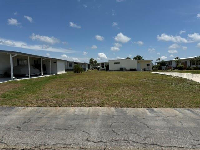 Imagine the possibilities with this lovely vacant lot, located near La Casa Recreation Hall, our large pool, and many other amenities. The property offers the ideal blend of tranquility and accessibility. Welcome to La Casa, an enchanting community where 974 homesites are beautifully set among native trees and surrounded by spacious common grounds and eight serene lakes. La Casa is conveniently located between Sarasota and Fort Myers with easy access to shopping, sightseeing, golfing, fishing, and our beautiful Suncoast beaches. La Casa is a friendly, family-oriented haven where you can enjoy tranquility while remaining close to vibrant attractions. Come visit our charming oasis and discover why La Casa is the ultimate destination for snowbirds and year-round residents!