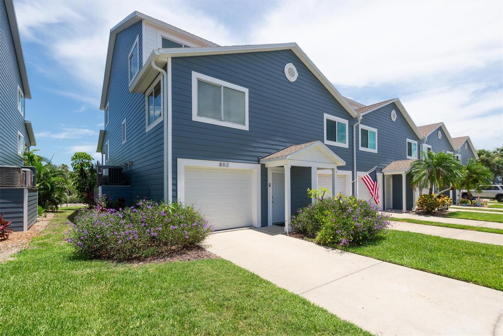 BEAUTIFULLY RENOVATED ISLAND HOME WITH HEATED COMMUNITY POOL & INTRACOASTAL DOCK – AVAILABLE NOW FOR ANNUAL LEASE!  Cable, internet, water and trash removal are currently included at no additional cost! Experience the Florida coastal lifestyle in this stunning 3-bedroom, 3-bath, 2-3 car garage townhome located in a highly desirable island community just a short walk from the Gulf beaches. Recently and thoughtfully renovated from top to bottom, this move-in ready home features updated roofing, electrical, plumbing, fresh interior paint, and attractive new exterior siding. The spacious open floor plan showcases elegant fantasy brown granite countertops throughout the kitchen and all bathrooms, while the beautifully updated kitchen offers abundant cabinetry and generous counter space that will delight anyone who loves to cook. Each of the three full bathrooms has been tastefully finished with oversized designer tile, custom glass shower enclosures, and en-suite access, creating a luxurious private retreat for every bedroom. Additional features include custom plantation-style shutters, a cozy fireplace, an in-home washer and dryer, and an oversized 3-4 car garage with plenty of room for vehicles, a golf cart, kayaks, bicycles, beach equipment, and even a workshop. Residents enjoy access to a waterfront community pool and a private dock on the Intracoastal Waterway, perfect for relaxing and enjoying spectacular water views. Ideally situated within walking or biking distance to the beach, waterfront parks, restaurants, beach bars, and a dog park, this exceptional home offers the very best of island living. Available now for annual lease. Schedule your private showing today and make this beautiful coastal retreat your next home!