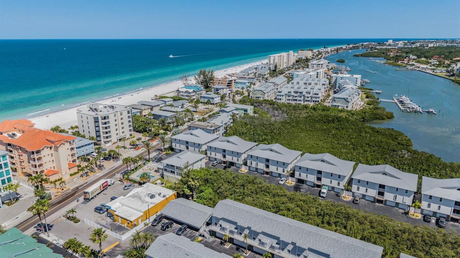 WELCOME TO PARADISE!!No milestone inspection required, no rental restrictions, a rare 2-car garage, and just a short walk to the beach—this one checks every box.

Welcome to your coastal retreat in the heart of Indian Shores. This beautifully updated 2-bedroom, 2.5-bath condo offers the perfect blend of modern upgrades, low-maintenance living, and an unbeatable beachside location. Even better, a brand-new roof has already been completed and fully paid for by the seller—delivering immediate value and peace of mind.

Step inside to a bright, open-concept living and dining area filled with natural light. The spacious great room features oversized 8-foot sliding glass doors that frame peaceful conservation views, creating a relaxed and inviting space for both everyday living and entertaining. A convenient half bath and indoor laundry closet are thoughtfully located on the first floor.

Upstairs, the primary suite offers a private retreat with an en-suite bath and glass-enclosed shower. Step out onto your private lanai and unwind with tranquil views of lush greenery—the perfect backdrop for morning coffee or a quiet evening.

This waterfront community enhances the lifestyle with resort-style amenities, including a sparkling pool and private dock access on the Intracoastal Waterway—ideal for kayaking, paddleboarding, or simply soaking in the coastal atmosphere. And of course, you’re just a short stroll from the sugar-white sands and turquoise waters of the Gulf of Mexico.

With no rental restrictions, this property offers outstanding flexibility—perfect for short-term rentals, Airbnb income, a second home, or full-time living. All of this, just minutes from local dining, shopping, and everything that makes beach life so desirable.

This is more than a condo—it’s a lifestyle opportunity.