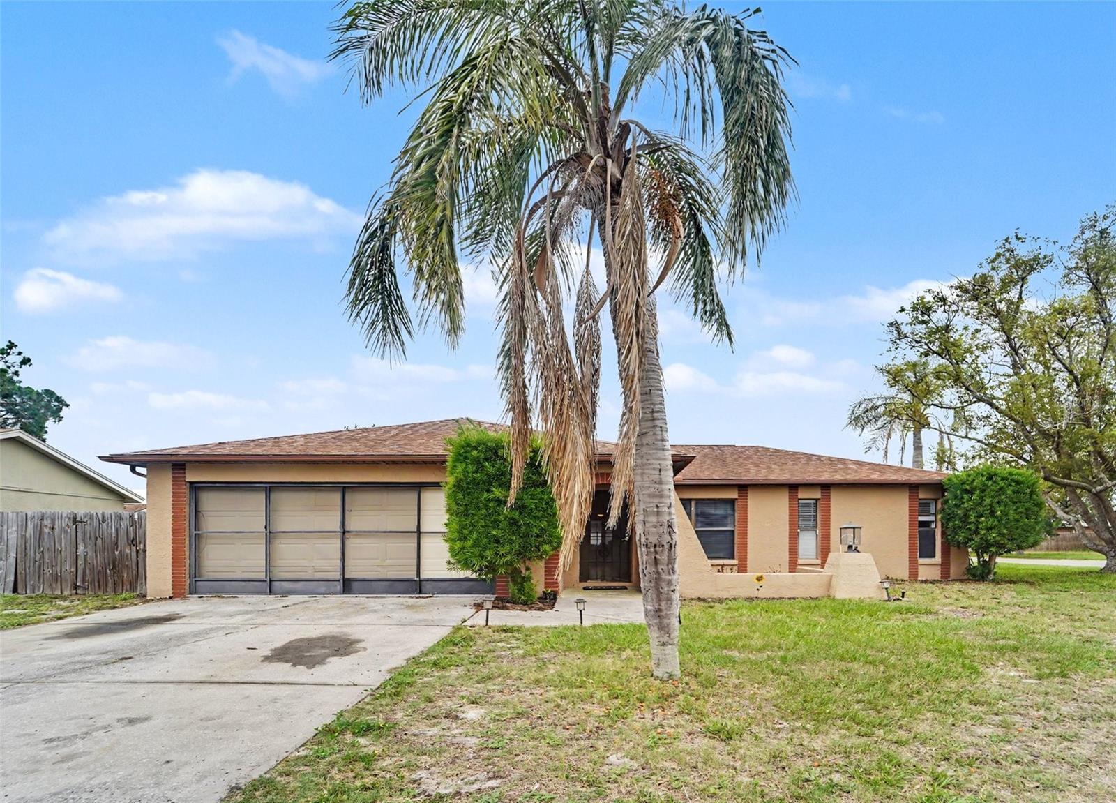 Welcome to this charming single-story home in the heart of Holiday! Featuring approximately 1,365 square feet of living space, this well-maintained residence offers a functional layout with spacious living areas, 2 bathrooms, and a generous lot size of nearly 7,500 square feet. Built in 1986 with durable block/stucco construction, the home includes central A/C, forced-air heating, and ample parking. Conveniently located near shopping, dining, schools, and Gulf Coast beaches, this property is perfect for first-time buyers, investors, or anyone seeking comfortable Florida living with no HOA restrictions. Enjoy easy access to major roadways and nearby parks while living in an established neighborhood with strong long-term value potential.