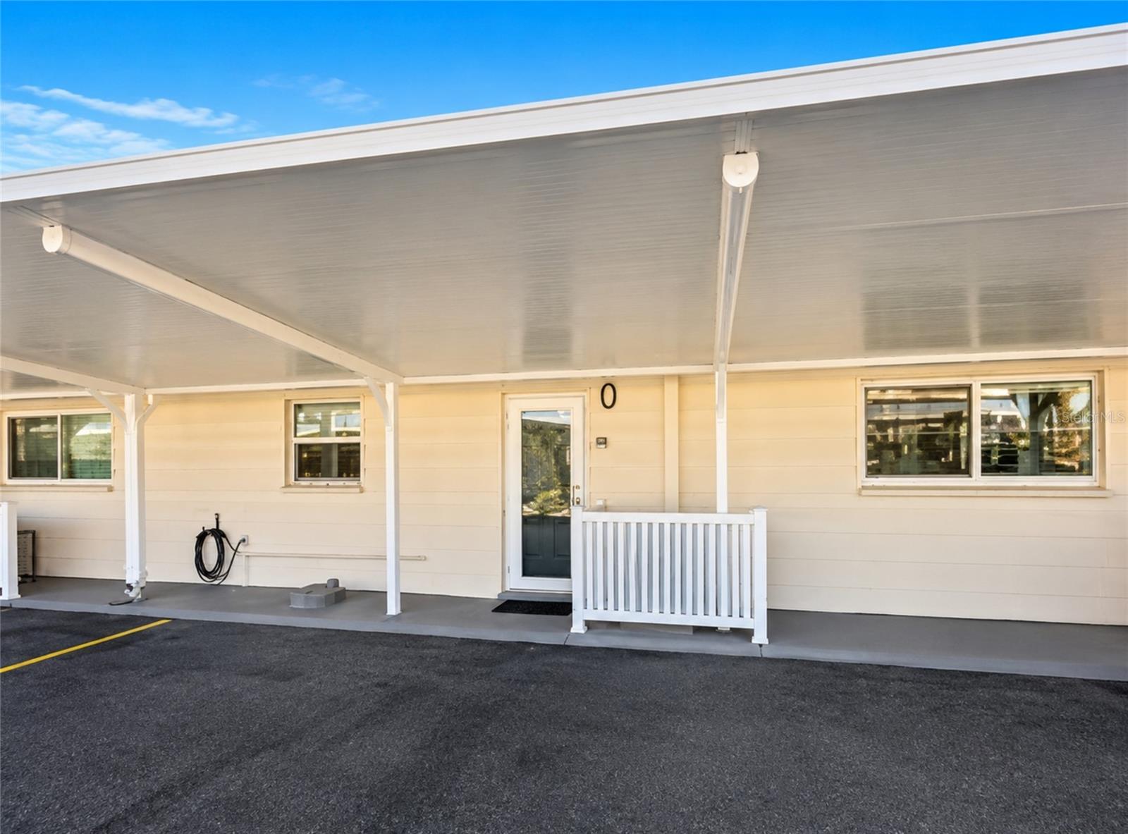 Welcome to Jamaica Royale #93, a beautifully remodeled two-bedroom, two-bath garden-view condominium nestled within the lush tropical grounds of Jamaica Royale on world-renowned Siesta Key. Offering 921 square feet of thoughtfully updated living space, this inviting coastal retreat showcases a complete 2025 renovation with quality finishes throughout, creating the perfect blend of modern comfort and relaxed coastal style.

The stunning new kitchen features custom cabinetry, elegant quartz countertops, a ceramic tile backsplash, new stainless steel appliances, and a new garbage disposal. Additional 2025 improvements include new HVAC systems (inside and out), a new hot water heater, fresh interior paint, stylish new furnishings, hurricane impact-resistant windows and sliding glass doors, luxury vinyl plank flooring in both bathrooms, new bathroom vanities and fixtures, and beautifully remodeled showers with ceramic tile surrounds, frameless glass doors, and contemporary finishes.

The spacious primary suite features a king-size bed, while the guest bedroom offers two queen-size beds, providing ample space for family and guests. Step outside to your private patio with comfortable outdoor seating—the perfect place to enjoy your morning coffee, dine al fresco, or relax after a day on the beach.

Located just steps from the world-famous powdery quartz sands and turquoise waters of Siesta Key Beach, owners and guests enjoy deeded beach access and an exceptional array of resort-style amenities, including three heated community pools, shuffleboard courts, community grilling areas, beautifully landscaped tropical grounds, and one assigned parking space. Public transportation conveniently stops directly in front of the community, providing easy access to Siesta Key Village's restaurants, boutiques, entertainment, and vibrant island nightlife.

Whether you're searching for a private beach retreat, seasonal residence, or an outstanding investment opportunity with excellent rental potential, Jamaica Royale #93 offers a truly turnkey opportunity in one of Siesta Key's most desirable beachfront communities!