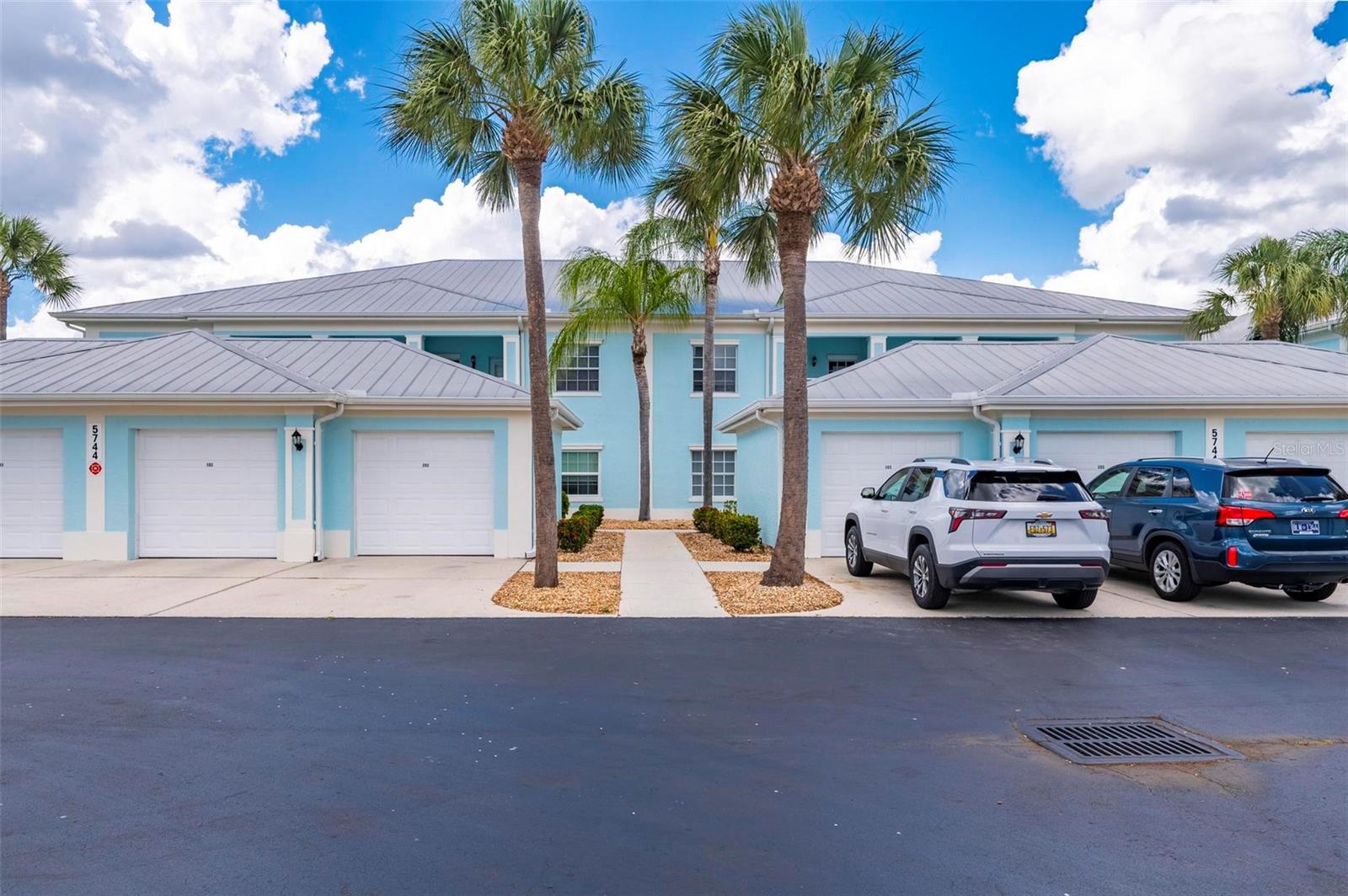 This stunning, updated end-unit located in the gated enclave of The Colony at Sabal Trace awaits you and your family. The move-in-ready home boasts a sophisticated, "clean-line" aesthetic with luxury vinyl plank and tile flooring throughout, perfectly framing the serene lake views visible from multiple rooms. The intelligent split-bedroom floor plan prioritizes privacy, featuring a guest suite at the front, a versatile central den, and a secluded primary retreat at the rear.

The heart of the home is an expansive open-concept living area and a gourmet kitchen equipped with granite countertops, a walk-in pantry, and a charming breakfast nook. Whether you are hosting friends at the breakfast bar or enjoying a quiet evening on the screened-in lanai, the seamless flow between indoor and outdoor spaces makes entertaining a breeze. Complete with a private single-car garage and access to premier community amenities—including a resort-style pool, fitness center, and clubhouse—this lakeside gem offers an unmatched blend of luxury and comfort.