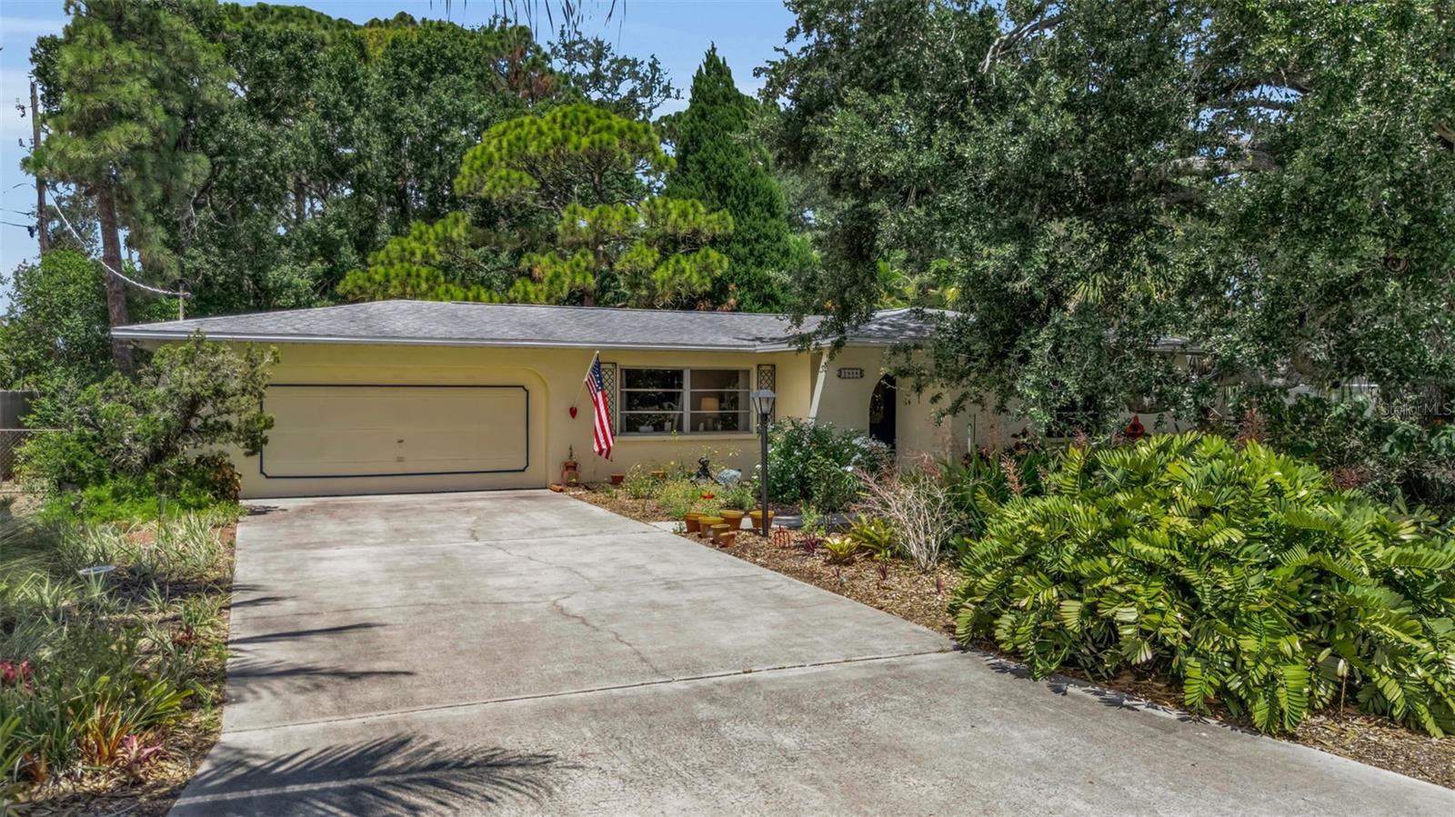 Endless Potential Meets One of Bradenton's Most Charming Hidden Neighborhoods! Nestled beneath the canopy of majestic grandfather oaks on an oversized, private homesite in the desirable West Woods neighborhood, this inviting residence offers a rare opportunity to create the Florida home you've always envisioned. Brimming with character, surrounded by mature tropical landscaping, and located just minutes from pristine Gulf beaches, shopping, dining, parks, and IMG Academy, this property is the perfect canvas for your dream lifestyle and NO DEED RESTRICTIONS or HOA.

From the moment you arrive, you'll appreciate the peaceful setting, established landscaping, and timeless charm that make this home feel tucked away in your own private oasis. The spacious lot provides exceptional privacy with plenty of room to design a custom pool, outdoor entertaining space, lush gardens, or simply enjoy the tranquility of your backyard retreat beneath the shade of mature trees.

Inside, the thoughtfully designed floor plan offers generous living spaces filled with natural light and endless possibilities. The expansive living and dining areas provide a wonderful foundation for updating to your personal style, while the functional kitchen offers ample workspace and overlooks the main living areas, making it easy to reimagine into the heart of the home.

The comfortable bedrooms provide peaceful retreats, and the home's solid layout creates an excellent opportunity for renovations that can truly maximize both value and functionality. Whether you're looking for a full-time residence, seasonal getaway, investment property, or renovation project, this home offers the flexibility to fit a variety of lifestyles.

One of the property's greatest assets is the incredible outdoor space. The oversized backyard is a private sanctuary surrounded by mature landscaping, offering ample room for a resort-style pool, outdoor kitchen, fire pit, or expanded entertaining areas. Few properties combine this level of privacy, lot size, and natural beauty in such a convenient location.

West Woods is a quiet, established neighborhood known for its oversized homesites, towering oak trees, and peaceful atmosphere yet it's just minutes from Robinson Preserve, De Soto National Memorial, Palma Sola Bay, Anna Maria Island, Bradenton's beautiful Gulf beaches, championship golf, restaurants, shopping, healthcare, and schools. Easily accessible to G.T. Bray County Park with 24 new world-class pickleball courts and free swimming pools, Bradenton Country Club, minutes from Blake Hospital as well as numerous medical and dental offices and facilities and schools!

Whether you choose to move in and update over time or completely transform the property into a custom showpiece, 1808 49th Street W represents an exceptional opportunity to own a home with incredible character, unmatched privacy, and unlimited potential in one of West Bradenton's most desirable locations. With great bones, an unbeatable setting, and room to create your own backyard paradise, this is your chance to bring your vision to life and enjoy everything the Florida lifestyle has to offer.