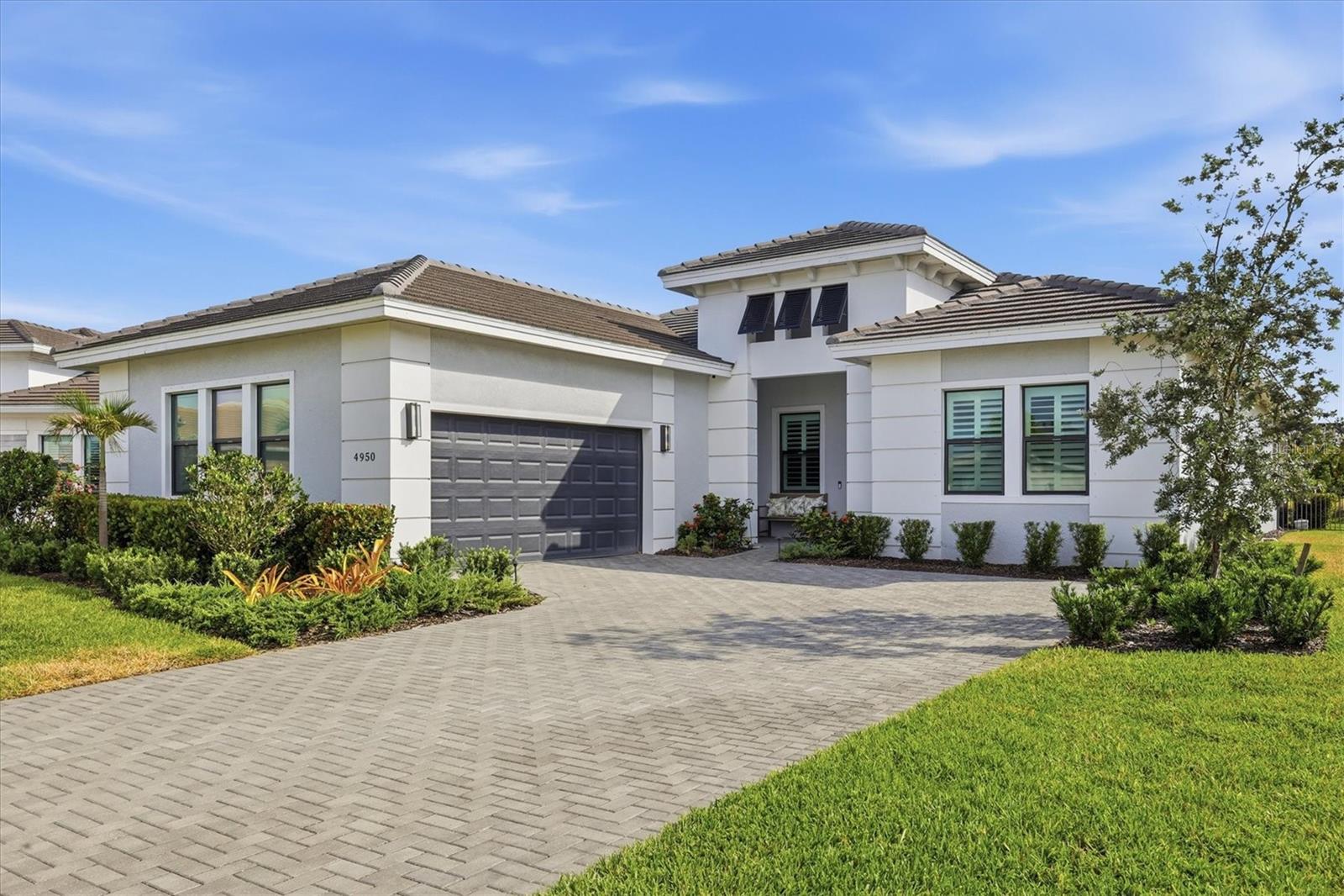 PRICE IMPROVEMENT!! OWNER HIGHLY MOTIVATED!! Located in the highly desirable 55+ EXLUSIVE RESORT-STYLE COMMUNITY of Cresswind at Lakewood Ranch, this Palm Beach model POOL HOME sits on an oversized FULLY FENCED lot that is just under ONE HALF ACRE and perfect for your furry friends. This home features an OPEN CONCEPT great room floor plan with high ceilings which makes this home feel so light and bright. The kitchen features a LARGE CENTER ISLAND ideal for entertaining, while the split-bedroom layout provides privacy with a spacious primary suite offering dual walk-in closets and a spa-style bath, plus two guest bedrooms each with their own ensuite baths. Additional highlights include a side-load garage and tile roof for strong curb appeal. Outdoor living is a standout with a private pool, and covered lanai with gas and water already in place for a future summer kitchen. Residents of Cresswind enjoy a resort-style lifestyle with a new clubhouse, fitness center, pool, tennis, pickleball, and a full calendar of social activities. Move-in ready and positioned on a premium lot, this home delivers the space, layout, and lifestyle. This one is an ABSOLUTE MUST SEE!