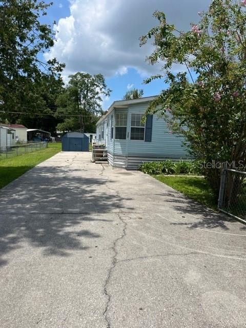 PRICE IMPROVEMENT on this spacious double-wide mobile home on land in the heart of Kissimmee. Close to Osceola Parkway and major roads, schools, hospitals, shopping and bus transportation. 3 BEDROOM 2 BATh split bedroom floor plan. Garden tub and shower in the master bathroom. Beautiful large kitchen with island and wall oven. Nice laminate flooring in the living areas and carpet in bedrooms. Fenced yard Outdoor storage shed.NO HOA. Seller financing is available to qualified buyers. Also accepting Conventional and VA financing!