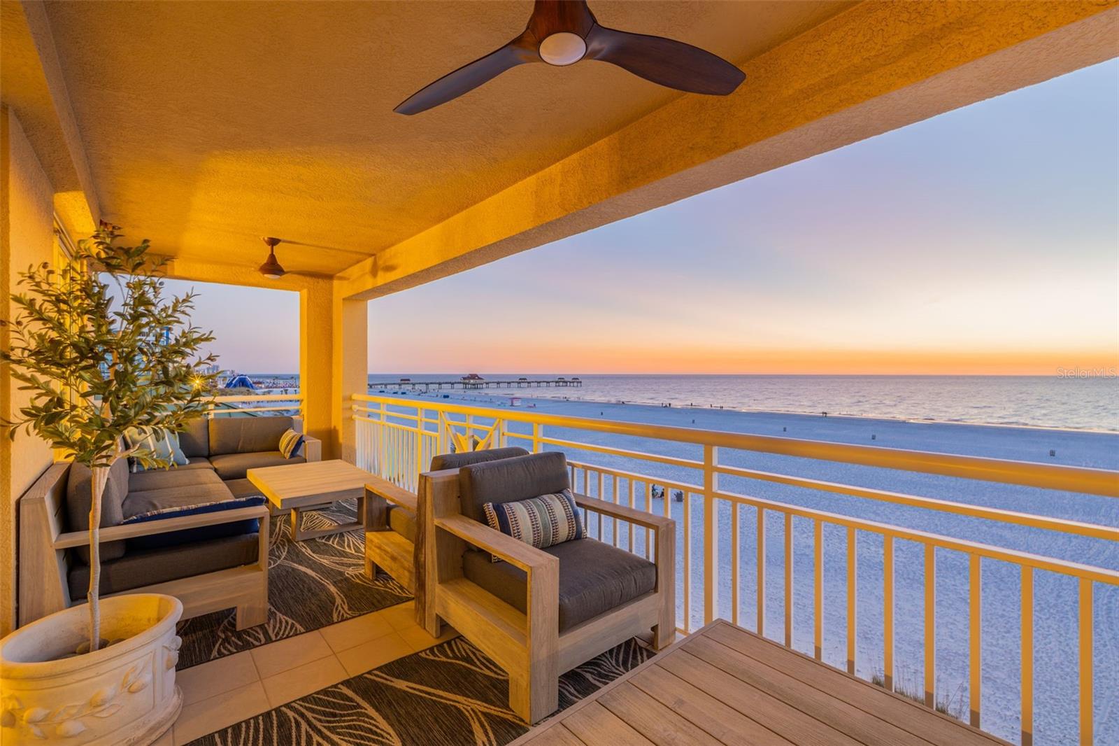 Widely regarded as one of Clearwater Beach’s most prestigious addresses, The Mandalay Beach Club offers resort-style Gulf-front living at its finest. This beautifully appointed three-bedroom, two-and-a-half-bath residence spans approximately 2,000 square feet and captures sweeping water views and unforgettable sunsets over Clearwater Beach and the Gulf.  Inside, an open floor plan creates generous living and entertaining spaces, anchored by a chef’s kitchen featuring GE Café appliances, a waterfall quartz center island with seating for four, and timeless custom cabinetry. The kitchen flows seamlessly into the dining and living areas, where expansive glass windows and doors frame the Gulf and open to a spacious balcony, perfectly designed for sunset cocktails and coastal breezes.  The primary suite offers a peaceful retreat with generous proportions, a spa-inspired bath with dual vanities, and a deep soaking tub. Two additional bedrooms provide comfortable accommodations for family and guests.  Life at The Mandalay Beach Club delivers the feel of a private coastal resort. Residents enjoy 24-hour security, a beachfront pool with spa, a state-of-the-art fitness center with sauna and showers, a clubroom, and direct private beach access. Additional amenities include two deeded parking spaces and private storage.  This is Clearwater Beach living at its most refined, where sweeping Gulf views, exceptional amenities, and an unmatched setting come together effortlessly.