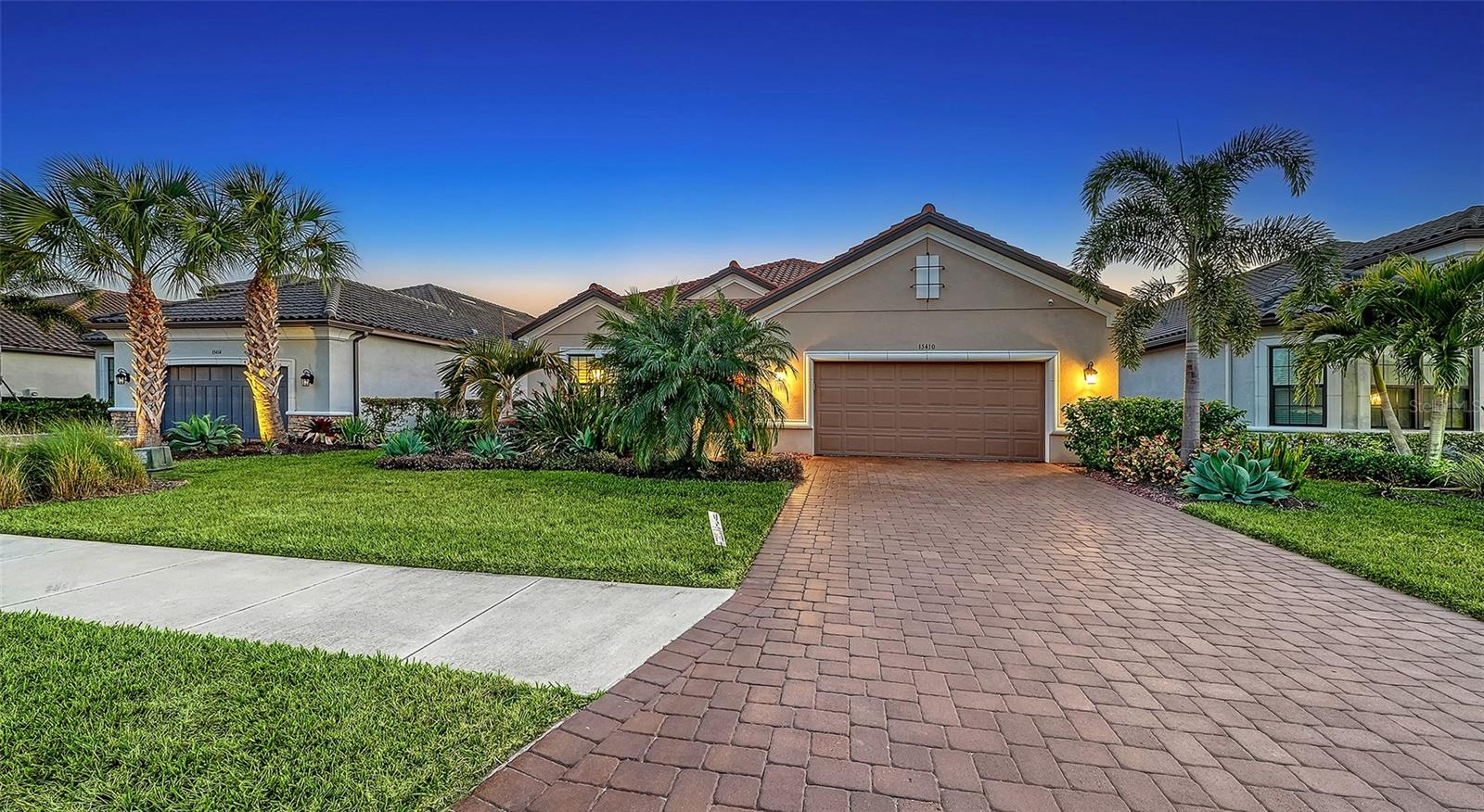Most sought after GOLF DEEDED Pallazio in Esplanade Azario with
the RARE and stunning lake and golf views! Before entering the home,
you will be wowed by the gorgeous outdoor landscaping that warms the
heart. As you enter this beautiful three-bedroom, three-bath-plus-den
home, you will notice all the exquisite custom designs in this open floor
plan. Beautiful laminate flooring, plantation shutters throughout, tray
ceilings and crown molding, designer lighting and fixtures, gourmet
kitchen with quartz countertops and soft close everything. The gourmet
kitchen also boasts a brand-new refrigerator/freezer, gas stove top and
new enlarged apron mount sink. The primary ensuite has a lovely sitting
area and spa like bathroom adjacent to a custom built in closet. There is
a whole house water filtration and softener, security cameras front and
back with home security system. For hurricane protection there are
accordion style smart guard shutters, and a MagnaTrack screen on the
lanai. As for storage, the kitchen pantry and master closets have custom
built ins, and the epoxy finished flooring in the extended garage has 2
hanging storage units. Step outside to view your personal piece of
paradise with the Southwest facing views of water and golf (16th hole).
With an outdoor kitchen and expanded lanai, here you will experience
the most beautiful, peaceful and private sunsets. If you desire a pool and
spa, here is your blank canvas with the best backdrop and views
awaiting your design. Esplanade at Azario offers worldclass amenities
including an 18-hole championship golf course, pro shop, culinary
center, fitness center, full-service spa, six tennis courts, sixteen
pickleball courts, a resort-style pool, Bahama Bar & Restaurant, coffee
shop, and casual pizzeria. (CDD fee is included in annual tax amount)
Ideally located near Sarasota’s finest dining, shopping, and awardwinning
Gulf Coast beaches, this home captures the essence of luxury,
leisure, and lifestyle.