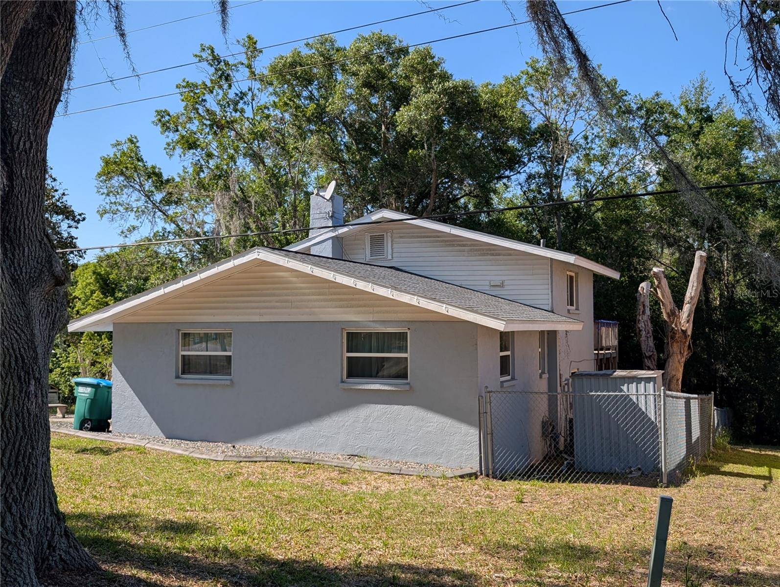 Huge Price Reduction Motivated seller! Possible owner financing with 20 percent down payment. This versatile property is ideal as an investment property, weekend retreat, or primary residence. Located just a few blocks from a public boat ramp to the Withlacoochee River and Lake Rousseau. Perfect for fishing and outdoor enthusiasts. Home features 3 bedrooms and 2 baths in a multilevel layout with a large deck overlooking the fenced back yard. New Reroof in 2022. Nearby amenities include Walmart, Beals, Tractor Supply, and many others. The area boasts the natural beauty of the Rainbow River, Gulf of Mexico, and Gothe Forest to name a few. Truly one of the Nature Coasts hidden gems.