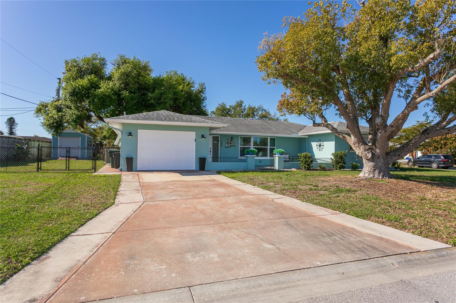 Welcome to your private slice of paradise in Venice Gardens. Perfectly positioned on an expansive corner lot, this exceptional residence offers the rare combination of refined design, modern upgrades, and the freedom of NO HOA-all connected to city water and sewer.
Step inside to discover the timeless elegance of original terrazzo flooring, beautifully complemented by a thoughtfully designed open flow that invites both comfort and sophistication. At the heart of the home, the fully renovated kitchen is a true showpiece—featuring custom cabinetry, sleek granite countertops, and a built-in wine refrigerator, creating an effortless setting for upscale entertaining.
Every detail has been carefully curated with quality and longevity in mind, including a newer A/C (2021), updated plumbing (2016), water heater (2022), electrical panel, hurricane-impact windows (2018) sliders are not hurricane nor 1 window in the kitchen, upgraded ductwork (2019). A brand-new dishwasher (2025) adds the finishing touch to this move-in-ready residence. Seamlessly blending indoor and outdoor living, the screened-in lanai opens to a lush, meticulously landscaped backyard-your own tranquil retreat. A powered storage/workshop shed adds both function and versatility to the outdoor space. RV and Boat parking next to house. Walking distance to Garden Elementary School. Ideally located just minutes from pristine Gulf beaches, fine dining, boutique shopping, boating, and world-class fishing, this home delivers the quintessential Florida lifestyle. Residents also enjoy optional access to the Venice Gardens community pool, enhancing the resort-style experience.