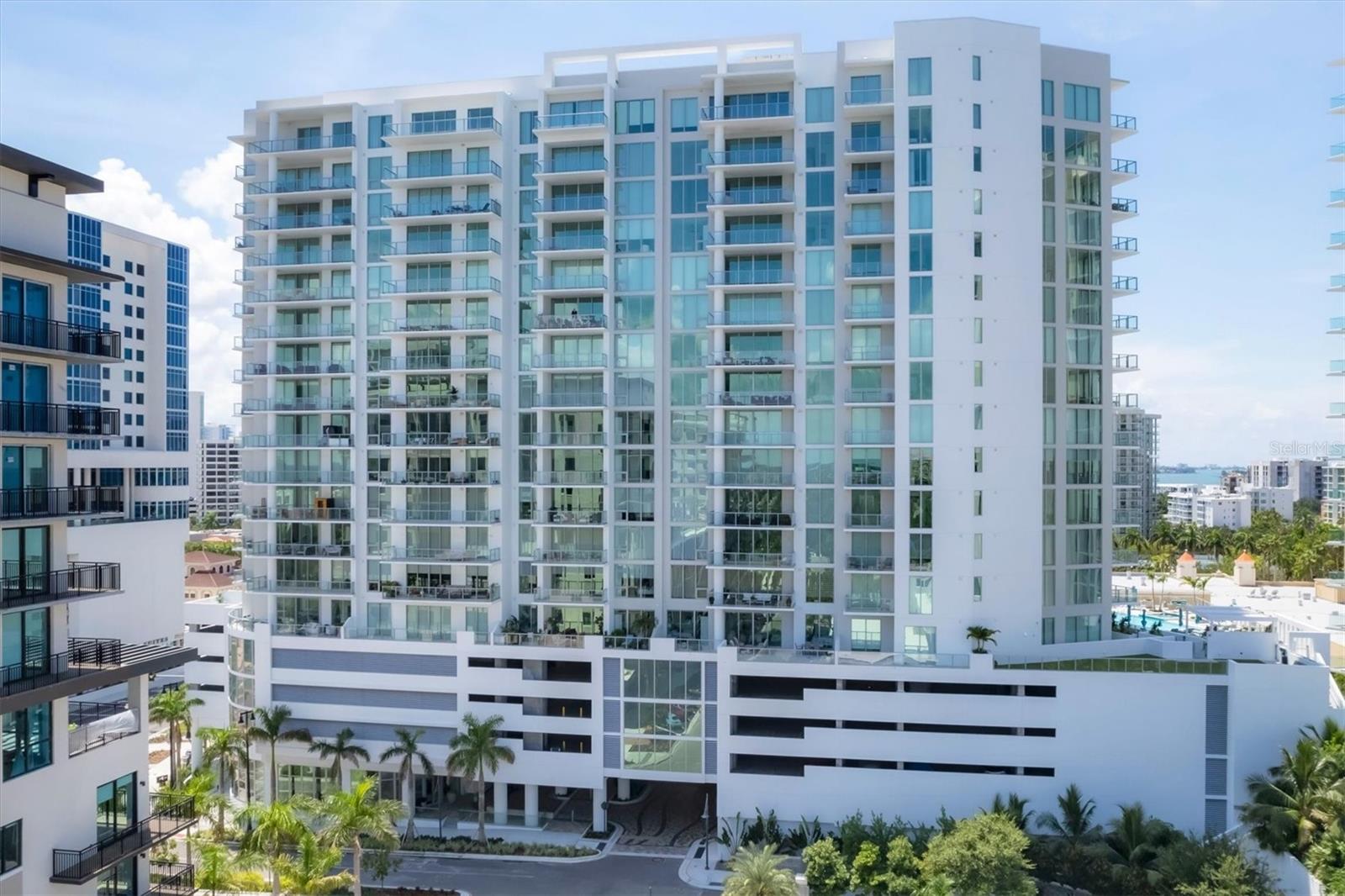 Welcome to the most sought-after residence in Sarasota’s premier downtown Bayfront tower at The Quay. This 18-level masterpiece of modern luxury redefines upscale living, offering an unparalleled blend of sophistication, convenience and breathtaking views. Designed for those who crave a refined, comfortable lifestyle, this iconic address is just steps from world-class arts, entertainment and fine dining. Positioned to capture Sarasota’s most dazzling sunsets, this exquisite 2,073-square-foot residence boasts expansive 12-foot ceilings, 10-foot glass windows and sliders, and an oversized 10-foot-deep terrace with sleek glass railings, offering amazing views of Sarasota Bay, the downtown skyline and the Gulf of Mexico. Every detail of this two-bedroom, three-bath home has been meticulously curated, from the designer European cabinetry and quartz countertops to the premium stainless steel appliances in the chef-inspired kitchen. The owner’s suite is a sanctuary of elegance, featuring custom walk-in closets and a spa-like retreat adorned with Grohe fixtures. Residents will enjoy an exclusive collection of five-star amenities, including a state-of-the-art fitness center, private movement studio, and a resort-style elevated pool and spa with an outdoor entertainment terrace. A dedicated dog park, on-site property management, 24/7 front desk attendants, and secure access-controlled entry ensure effortless living with ultimate peace of mind. This is Bayso’s most desirable residence, a rare opportunity to own in the city's best new address. Private showings are available by appointment, in-person or virtually. Secure your piece of Sarasota luxury today.