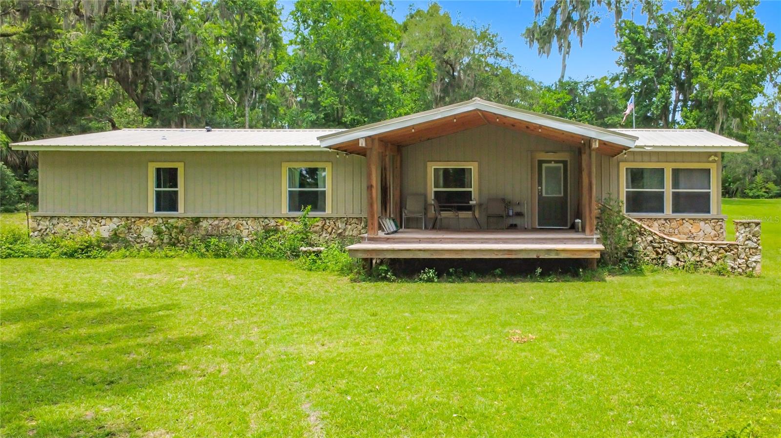 Location Location!! Beautiful park like 6 acre nested in the NW beautiful horse farms. This is a rare find about 2.5 miles from HITS and 11 miles from the World Equestrian Center. 3 bedrooms 2 baths nice covered front porch, 2 car garage with half bath plus a 14 x 28 room on the back used a workout room that could be used for many uses. fenced and cross fenced also a large garage behind the home. New well in Jan. 2026