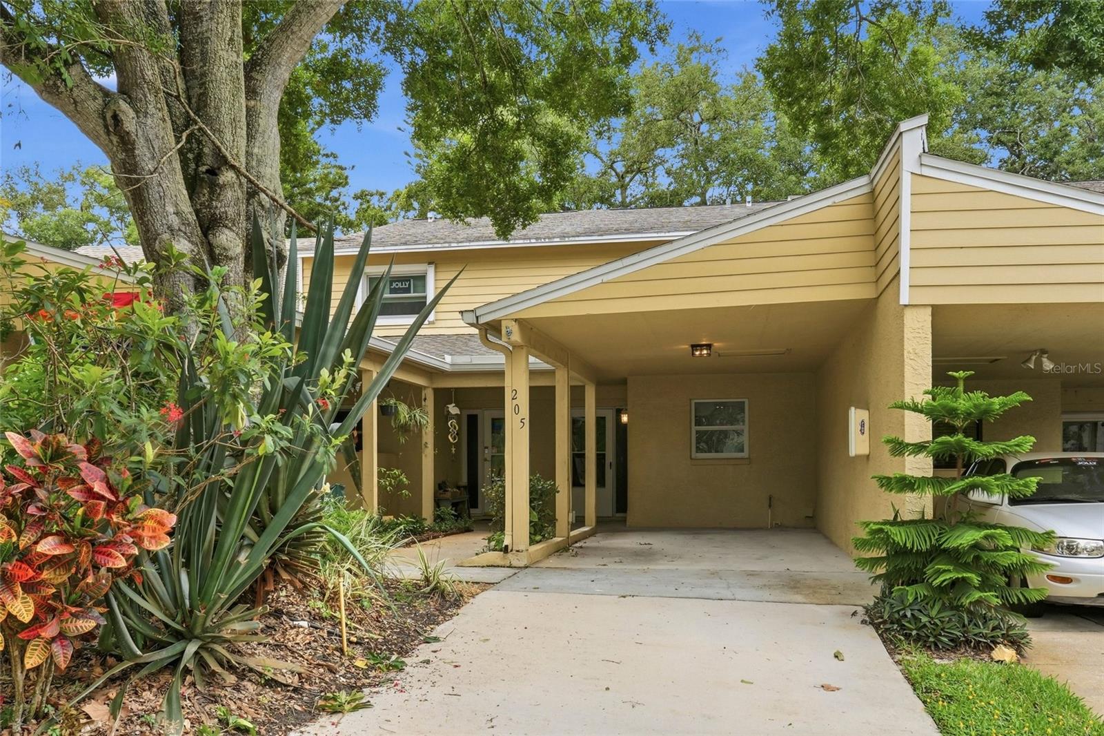 Welcome to the Villas of Somerset Woods—your beautifully renovated 2-bed, 2.5-bath SANCTUARY tucked inside a quiet cul-de-sac community. This charming townhome with a covered carport offers the perfect blend of comfort, style, and convenience. Step inside to an open-concept first floor filled with natural light, featuring a spacious living area anchored by a cozy wood-burning fireplace. The fully updated kitchen shines with luxurious quartz countertops, modern cabinetry, premium stainless-steel appliances, and a breakfast bar ideal for casual dining. A convenient half bath and an oversized laundry room complete the main level. Upstairs, you’ll find two generously sized bedrooms, each with its own updated bathroom, including a primary suite with a private balcony—a peaceful spot to unwind. Enjoy exceptional storage with two exterior storage closets, one on each floor. Relax and recharge at the sparkling community pool, just steps from your front door. All of this in a prime Palm Harbor location minutes from beautiful beaches, parks, shopping, dining, and major airports. A rare opportunity to own a stylishly updated townhome in a serene, well-kept community—this one checks all the boxes. **Although this home is a townhome, it is located within a condo community and is not eligible for FHA/VA financing.**