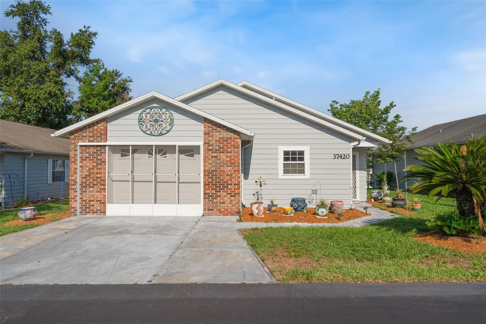 Discover your perfect Florida retreat at 37420 Teaberry Loop in Zephyrhills! Located in a desirable 55+ community, this beautifully updated home is designed for comfort, convenience, and easy Florida living. The kitchen has been completely redone with stylish finishes and modern updates, while brand-new flooring throughout creates a fresh, cohesive feel. A brand-new roof provides added peace of mind for years to come.

Thoughtfully outfitted for handicap accessibility, this home offers ease of living for all residents. Relax with your morning coffee or entertain friends in the fabulous Florida room, and enjoy the added versatility of the screened-in garage. Residents also have access to community amenities, including a clubhouse and fully accessible common areas, creating a welcoming and active lifestyle. Don’t miss this wonderful opportunity to own a move-in-ready home tailored for comfort, convenience, and enjoyment!