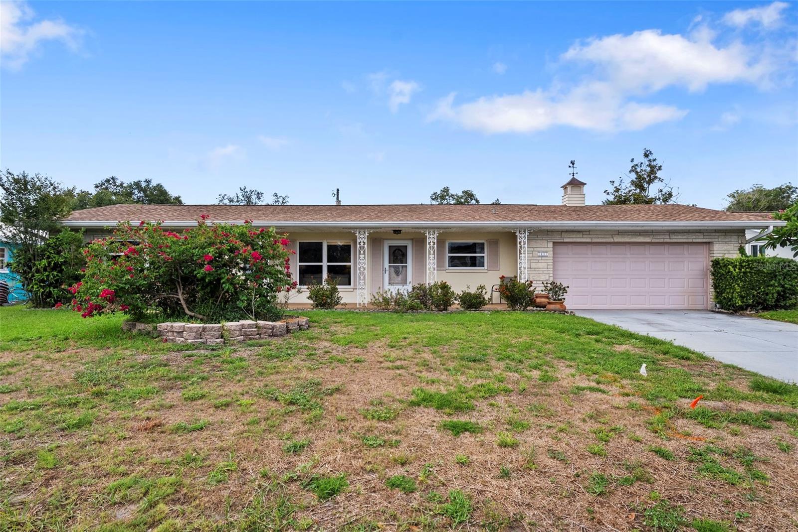 Welcome To Your Slice of Clearwater Paradise! This Light-Filled, 1,438 Sq. Ft., 2-Bedroom, 2-Bath Home Sits in a Peaceful, Cozy, Walkable Neighborhood Just 5 Miles from World-Famous Clearwater Beach. Step Inside to Bright, Airy Living Spaces Filled with Natural Light and Designed for Comfortable Florida Living. Both Generously Sized Bedrooms Easily Accommodate King-Size Beds, Providing Plenty of Room to Relax and Unwind. A Separate Dining Room Leads to One of the Home's Most Captivating Features: A Stunning All-Windowed Bonus Room Offering Panoramic Views of Your Spacious, Private, Fully Fenced Backyard. Whether You're Enjoying Your Morning Coffee, Reading A Book, Or Entertaining Friends, This Sun-Drenched Retreat Seamlessly Brings the Beauty of the Outdoors Inside. An Oversized Backyard Offers Endless Possibilities for Gardening, Recreation, and Relaxation. Established Wine Grape Vines Still Grow Tall, Adding A Unique Touch to This Outdoor Haven, While There Is Plenty of Room for Pets to Roam, Children to Play, Or Simply to Soak Up the Florida Sunshine. The Oversized 2-Car Garage Features a Convenient Second Kitchen, A Wonderful Luxury for Entertaining Guests, Hosting Gatherings, Or Serving Holiday Meals. Just Beyond is the Enclosed Florida Room That Provides Yet Another Inviting Space Where Family and Friends Can Gather Year-Round. Enjoy The Best of Both Worlds: A Quiet Residential Setting with Convenient Access to Everything Clearwater Has to Offer. Beautiful Parks, Diverse Dining Options, Shopping, Entertainment, Golf, And the Sparkling Gulf Beaches- All Just Minutes Away. Including Neighboring Dunedin and Tampa International Just 25 Mins. If You're Looking for Space, Privacy, Natural Light, and the Florida Lifestyle, This Clearwater Gem Is Ready To Welcome You Home. Roof 2024