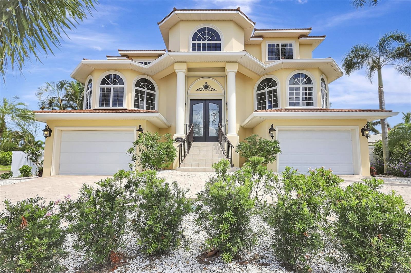Live the resort lifestyle every day in this breathtaking waterfront retreat in Treasure Island. With timeless Mediterranean elegance and coastal charm, this custom-built home offers panoramic water views, spacious indoor-outdoor living, & luxurious touches throughout.

Step through the double entry doors into a bright, open interior designed for both comfort and sophistication. The 2nd floor living area flows seamlessly onto a large waterfront patio, perfect for relaxing or entertaining with sunset views over Boca Ciega Bay. A spiral staircase leads down to the pool, spa & grilling station, where lush surroundings & bay breezes create your own private paradise.

The heart of the home is the expansive kitchen, ideal for gathering with family & friends. It features generous prep space, custom cabinetry, & a walk-in pantry. Adjacent to the kitchen is a stunning butler's pantry, complete with a wet bar, designer cabinetry, & a wine chiller; an entertainer's dream.

The family room, complete with a cozy fireplace, invites year-round enjoyment, while multiple access points—including from the first-floor yard level & the 2nd floor patio—make indoor & outdoor living effortless.

Boaters will love the deep sailboat water access, 10,000 lb boat lift, & extended dock all just steps from your backyard. Whether you're heading out to the Gulf or watching dolphins play from the dock, this location offers the ultimate in waterfront living.

Additional features include high-impact windows & aluminum-tiled metal roof, Cat 5 wiring, surround sound, and security system. Concrete seawall & cap, smoke & carbon monoxide detectors.

Enjoy peaceful mornings by the pool, vibrant evenings on the water, & a lifestyle that feels like a permanent vacation. Conveniently located near Florida's finest beaches, airport access, top-rated dining, shopping, and more! This home is the epitome of coastal luxury.