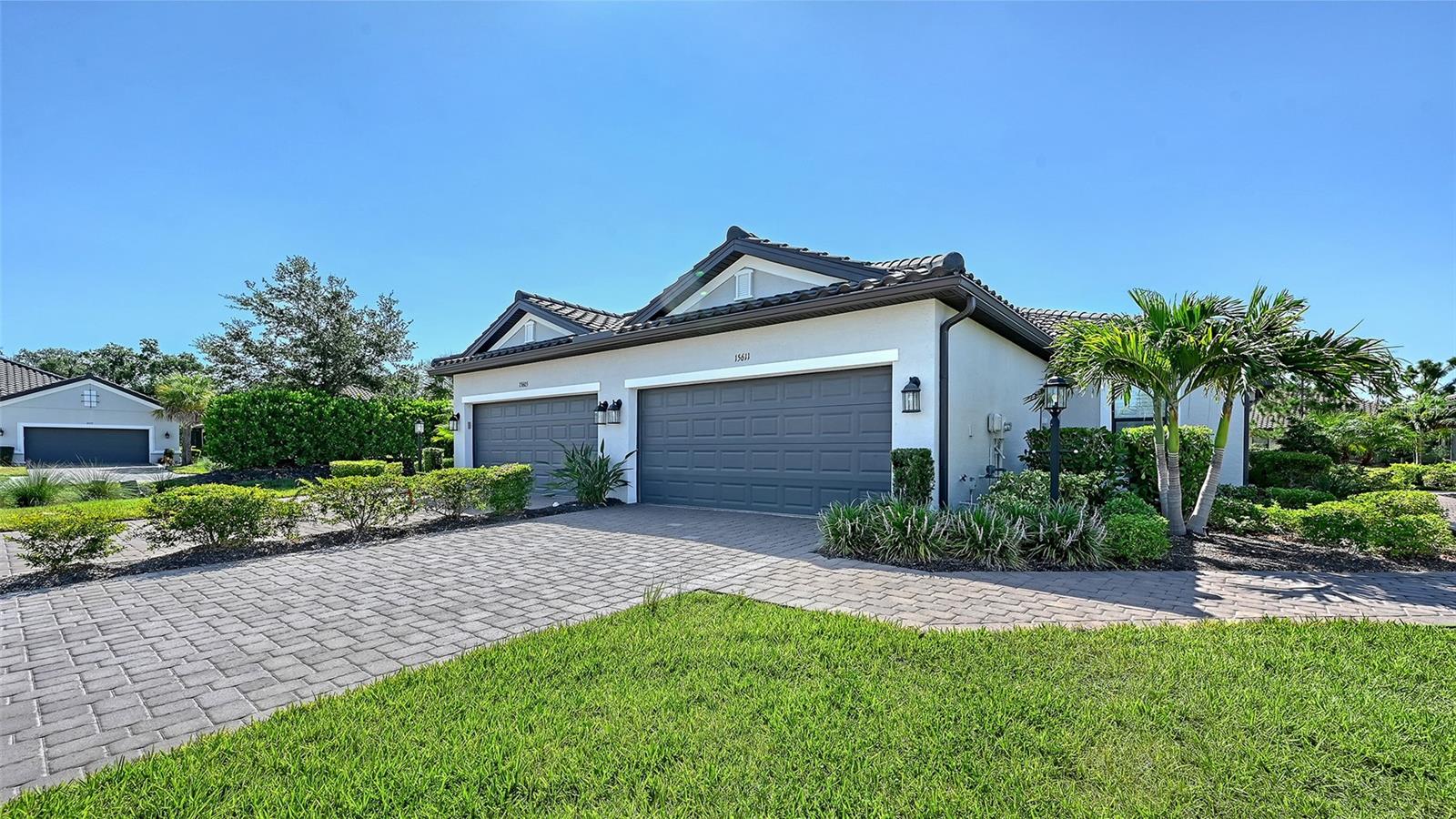Don't miss this exceptional opportunity to own a beautifully appointed villa in the highly sought-after, resort-style community of Esplanade at Azario at Lakewood Ranch. Offering the perfect blend of luxury, comfort, and maintenance-free living, this exceptional residence showcases elegant finishes, custom window treatments throughout with an expansive open-concept floor plan, and seamless indoor-outdoor living designed for both everyday comfort and effortless entertaining.

• The thoughtfully designed open layout creates a bright, airy atmosphere, with the spacious living and dining areas flowing effortlessly into the contemporary kitchen. Featuring quartz countertops, premium stainless steel appliances, clean-lined shaker style cabinetry, a beautiful tile backsplash, and a large convenient breakfast bar, the kitchen serves as the heart of the home—perfect for preparing meals while staying connected with family and guests.

• The luxurious owner's suite offers a peaceful retreat, a spacious walk-in closet, and a spa-inspired en-suite bath with dual vanities, quartz countertops, and an oversized glass walk-in shower. Down the hall and separate from the main living area is a generously sized guest bedroom with a walk-in closet and bathroom with tub shower. Additionally, a versatile flexible room serves as space for guests, a home office, or hobbies. Beautiful tile flooring throughout the main living areas adds both style and easy maintenance.

• Step outside to the extended screened lanai, where professionally landscaped greenery and peaceful views create the perfect backdrop for enjoying your morning coffee, relaxing with the evening breeze, or entertaining friends and family.

• As a resident of Esplanade at Azario, you'll enjoy maintenance-free living and an unmatched resort lifestyle with exceptional amenities, including a stunning clubhouse with a full-time lifestyle director and year-round social events, a resort-style pool and state-of-the-art fitness center, tennis and pickleball courts, scenic walking trails, wellness services, and three on-site restaurants—Bahama Bar, Barrel Bistro, and Olive & Vine.

• Ideally located near shopping, dining, and top-rated schools, this exceptional villa offers the perfect combination of location, luxury, and lifestyle.

• Call today to schedule your private showing and discover everything this exceptional home and resort-style community have to offer!