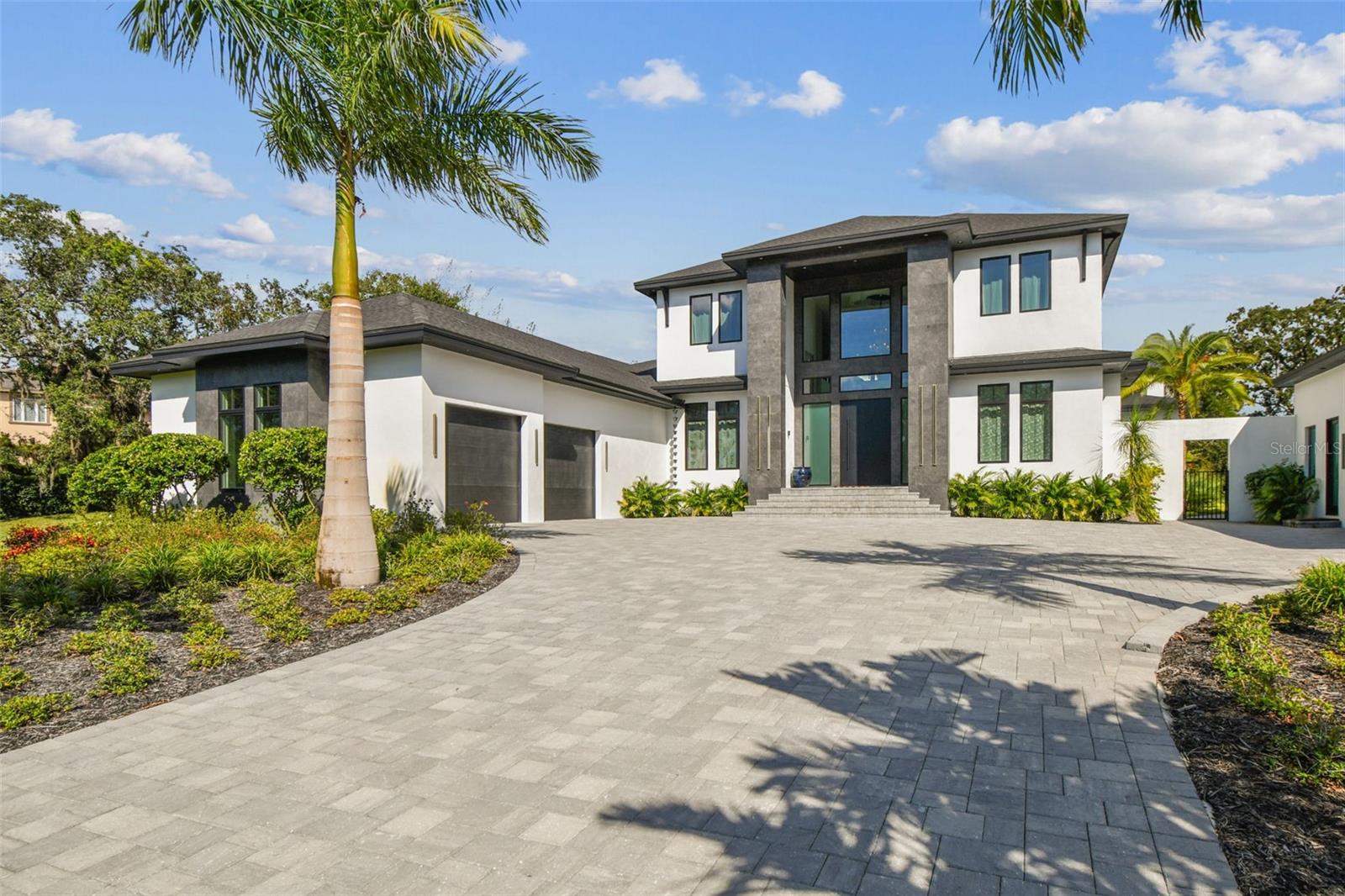 Pre-Construction. To be built. Ready to break ground on this fabulous new custom home where you select your own premium finishes and final touches! If you’ve been dreaming of the tranquility and privacy of a premium custom home on an expansive lot in Safety Harbor; Welcome to 3321 Meander Lane! This 2.65-acre property sits in Safety Harbor on a quiet, dead-end street with no through-traffic. A private gated entrance leads to your future retreat, a home designed with sophistication, energy-efficiency, and modern comfort in mind. From the moment you step into the grand, sunlit foyer, you’ll notice the abundant natural light and a layout crafted for unparalleled luxury, privacy, and space all perfectly tailored for those seeking an exceptional Floridian lifestyle. The open-concept living space centers around an expansive great room with 12’ ceilings and oversized windows that frame the lush outdoors, creating the ideal backdrop for both relaxing evenings and lively entertaining. A chef’s dream kitchen awaits, outfitted with top-of-the-line stainless steel appliances, custom cabinetry, premium quartz countertops, a large center island, a secondary walk-in prep kitchen/pantry and a coffee bar. Entertain with ease from your full bar and wine area just off the main kitchen. This home comes equipped with a private home theater, an expansive split lanai layout for your outdoor kitchen and living areas, a formal dining room for large gatherings, and a loft/game room for entertaining. Throughout the home, luxurious details such as cathedral ceilings, specialty accent walls, and custom walk-in closets enhance both comfort and style. The first-floor owner’s suite provides a peaceful retreat, complete with a luxurious ensuite bathroom which includes a large double shower and dual vanities. With three additional spacious bedrooms, each offering full ensuite bathrooms, you’ll have plenty of space and comfort for family or guests. Step outside to your private serene property, where you can delight in riding your horses or fishing in your own private pond. The covered premium outdoor kitchen and lanai invite you to sit back and enjoy the beautiful Florida weather while overlooking your new saltwater pool. The main home contains a 3-car garage for your everyday vehicles, with ample space to store all your toys. The home includes modern conveniences such as premium efficiency/multi-zoned central air conditioning, tankless insta-hot water heaters, natural gas supply, and county water. Located in the prominent Safety Harbor community, this property offers peaceful, private living while still being conveniently close to dining and amenities. The home is also close to top-rated schools, local beaches, parks, and shopping. This one-of-a-kind property, with its luxurious features, expansive lot, and prime location, won’t stay on the market long. Schedule your private consultation today and discover the possibilities that await at 3321 Meander Lane. Your dream home is just a call away! NOTE: *Existing home on property to be removed. Some photos contained in this listing include available upgrades not presently included in the list price.