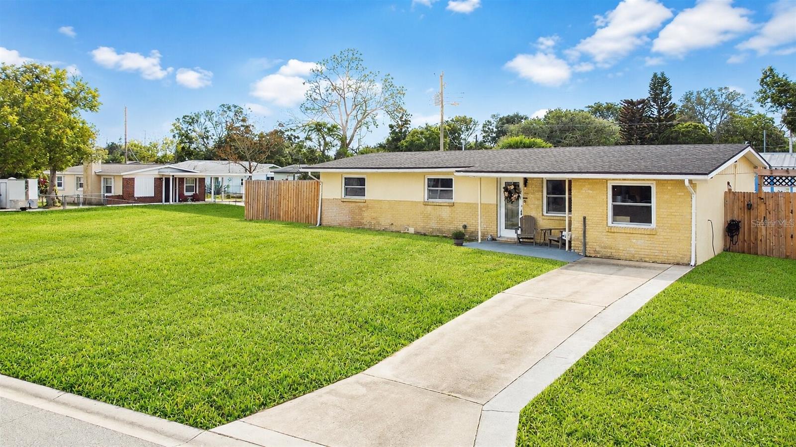 Welcome to 53 High Ridge Rd, a meticulously maintained 4-bedroom, 2-bath home that perfectly captures the essence of Florida living. From the moment you arrive, the charming curb appeal, sitting up high is evident with its clean exterior, extended driveway, and vibrant landscaping.

Step inside to discover updated interiors featuring modern flooring throughout. The living room, primary bath, and office have all received a fresh coat of paint, enhancing the inviting atmosphere.
The spacious primary suite showcases elegant gray tones, ample room for furniture, and a sleek wall-mounted mini-split system that ensures comfort year-round. New windows and slider make the home feel fresh! The functional kitchen is both welcoming and practical, equipped with warm wood cabinetry, a center island with vegetable sink, recessed lighting, and an upgraded kitchen faucet. The open layout flows seamlessly into the dining area, where sliding glass doors bathe the space in natural light and lead to your own private backyard.
Step outside to your outdoor retreat! The fully fenced backyard is designed for relaxation and entertainment, featuring a screened-in patio perfect for sipping morning coffee. On hot Florida days, cool off in the inviting spa/pool area. Additional storage space can be found in the detached shed, and there's plenty of green space for pets, play, or hosting gatherings with family and friends.
With four spacious bedrooms, two full baths, thoughtful upgrades, and multiple indoor-outdoor living options, this Daytona Beach home provides true comfort and flexibility. Move-in ready and brimming with charm, 53 High Ridge Rd is waiting for you to call it home. Don’t miss out on this exceptional opportunity!