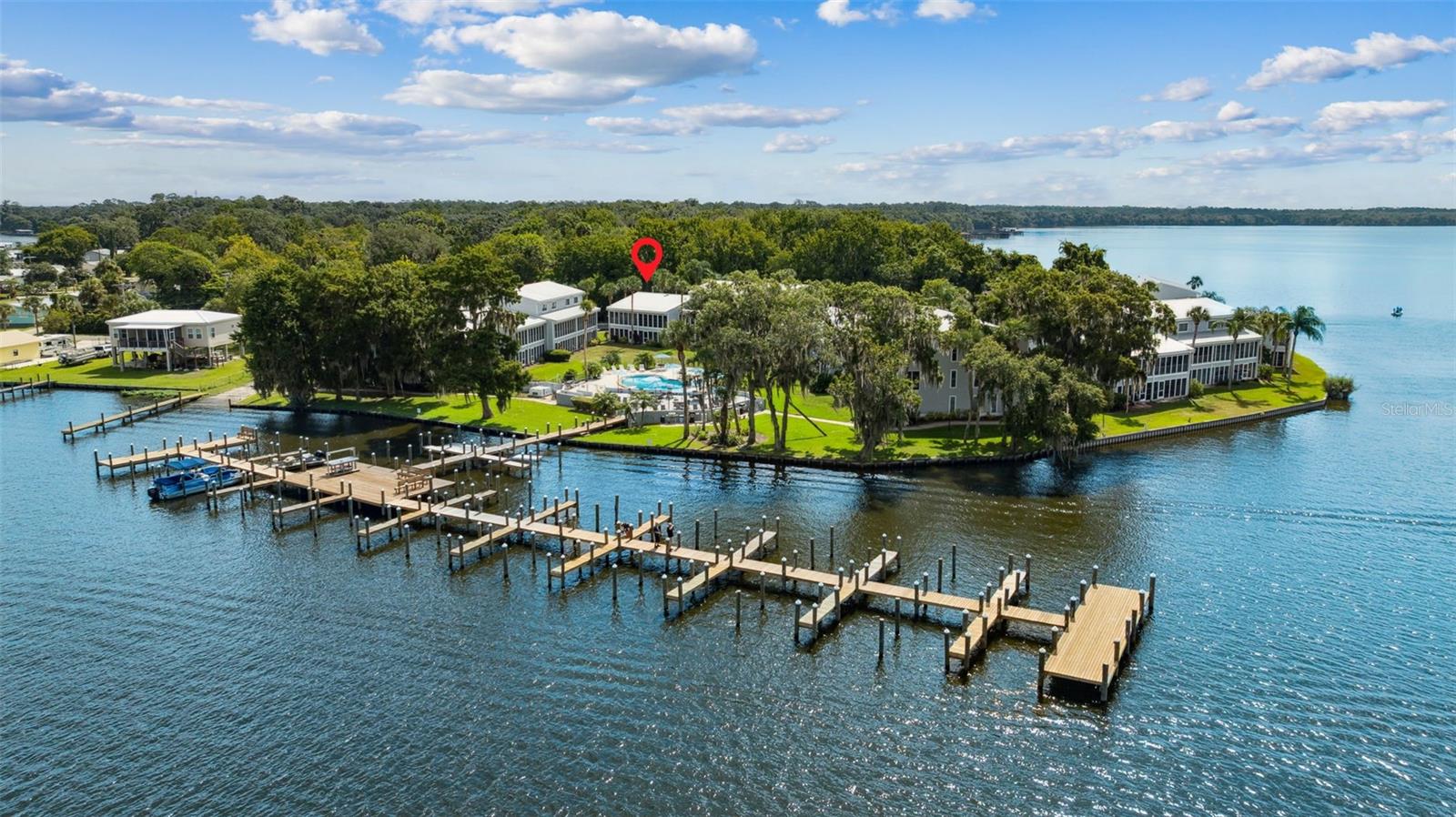 St. Johns River Appeal in Welaka Florida
Experience exceptional waterfront living with this impeccably maintained, fully furnished second-floor residence overlooking the stunning St. Johns River. The unit offers a commanding river view that enhances daily living with serene, ever-changing scenery. Move-in ready, it includes all essential furnishings—bedding, kitchenware, and tasteful décor—so you can simply bring your personal items and settle in.
Community amenities elevate the riverfront lifestyle: enjoy the sparkling pool framed by expansive river vistas, relax on the enclosed back porch while taking in the tranquil water backdrop, and take advantage of the community boat ramp for effortless access to the river.
Conveniently located near dining, entertainment, golf, at the Oaks Golf Course and natural attractions such as Welaka State Forest—with Palatka (approx. 35 minutes) and St. Augustine and beaches (approx. 50 minutes) away—this property is ideal for those seeking a refined blend of comfort, relaxation, and vibrant waterfront living.