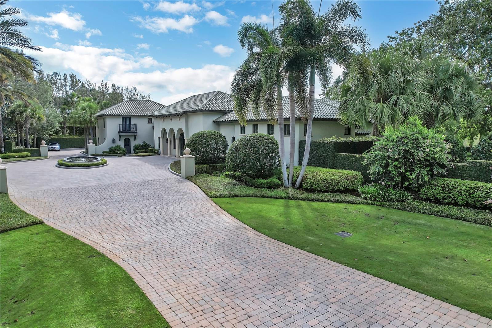 Masterfully designed with exquisite architectural detail, this modern fortress was completed in 2011 with only the finest of finishes. The 4 bedroom, 6 bath residence overlooks 3.67 meticulously manicured acres. And, with just under 11,000 square feet under roof, the home features extensive custom moldings, 7” rift cut Oak flooring, extensive custom-built cabinetry and much more. The stunning primary suite includes his and her private dressing rooms with spa bath of handpicked Italian marble overlooking a private garden. The epicurean kitchen has a large marble island with vegetable sink, Wolf commercial six-burner gas range, separate gas grill and side burner, Subzero refrigerator, Subzero freezer, Gaggenan built-in ovens, (2) Bosch dishwashers, (2) walk-in pantries, warming drawer and built-in workstation. Other notable features of the home include the study with gas fireplace, a butler’s pantry, bar with hammered sink and mini refrigerator, a walk-in linen closet, and lovely powder bath.

Downstairs there is a large, carpeted playroom, a 10x23 studio/dark room, locked gun closet, wine cellar, 23x24 cinema room with 8 overstuffed chairs and 35x49 unfinished basement.

Additional features include the climate controlled Geo-thermal system, whole-house generator, whole-house leak detection system, (2) tankless hot water heaters, and a whole-house reverse osmosis system.

There is a seamless transition from the interior of the home to the exterior screened lanais and expansive terraces which allow for stunning views of the park-like setting overlooking the private pool and spa which becomes part of the home's living experience. A significant value for the buyer who secures this amazing home and property.