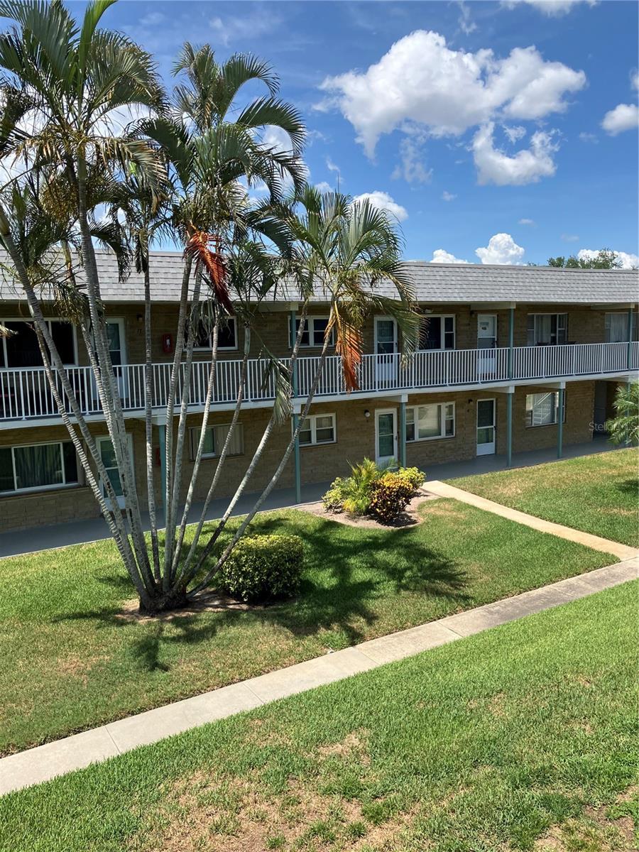 Friendly 55+ condo community with covered parking, heated swimming pool, clubhouse activities. Two bedroom, one bath unit on the second floor, faces South. Newer windows and A/C. Furnished or empty - your choice. Gas stove. Florida room. Beaches are a short drive away, within five miles. Bay Pines VA hospital within 3 miles. Convenient to shopping, e.g. Publix is one block away.
