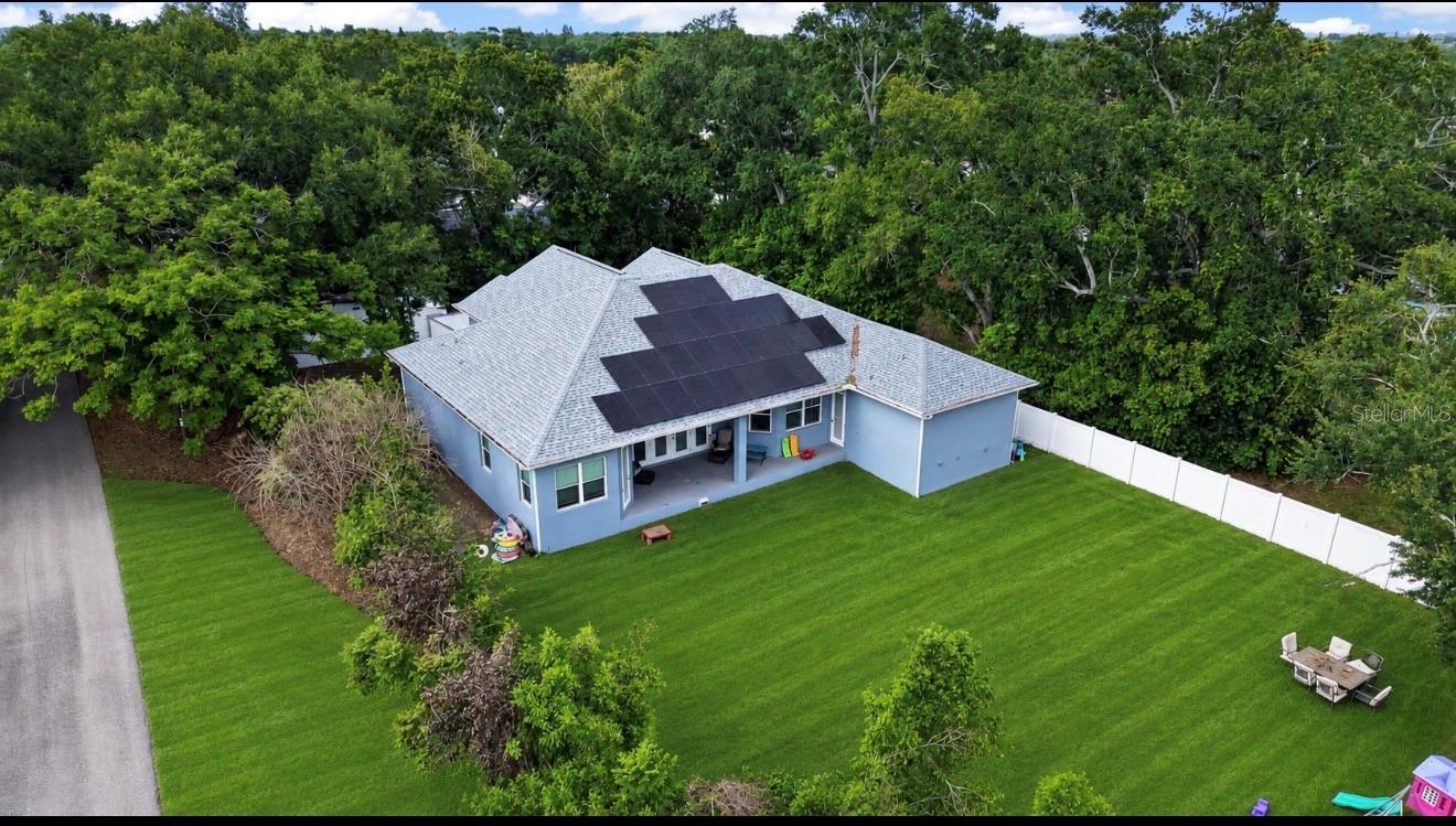 One or more photo(s) has been virtually staged. WELCOME HOME!! This Exceptional New Construction (2024) sits on Nearly 1/2 Acre in Unincorporated Seminole and is a NO FLOOD ZONE. A rare and refined offering in the heart of Seminole — this immaculate 2024-built residence presents five bedrooms and three full baths wrapped in thoughtful contemporary design and premium finishes. Set on just under a half acre with coveted unincorporated zoning, the property unlocks extraordinary lifestyle possibilities: equestrian use, an accessory dwelling unit, or expanded recreational amenities. Imagine an elegant poolscape, a private pickleball court, a bespoke barn, or an expansive entertainment lawn — the canvas is yours. Step inside to discover a luminous, open plan crafted for both gracious entertaining and relaxed family life. Oversized living areas flow seamlessly to the outdoors, while well-proportioned bedrooms provide tranquil private retreats. The primary suite is a serene haven with spa-inspired finishes and ample closet space; additional bedrooms are generous and adaptable for guest quarters, office, or hobby rooms. Designer-inspired touches, high-quality fixtures, and modern lines throughout elevate everyday living without compromising comfort. Energy efficiency and modern convenience are exceptional highlights here — the property features fully paid-off solar panels, delivering dramatically reduced energy costs (electric averages around $30/month), plus contemporary mechanicals and new-construction warranties for added peace of mind. Outside, the backyard is fully enclosed by a vinyl privacy fence, offering secure, secluded grounds ideal for family, pets, entertaining, and luxurious outdoor upgrades. Opportunities to acquire newer construction on acreage in Seminole are exceedingly rare. Whether you seek a private estate, an active equestrian property, or the freedom to build an ADU, this home presents unmatched flexibility and immediate move-in quality. Dream big — schedule your private showing today and envision the extraordinary possibilities at 11560 110th Ave N. DON'T DELAY....SCHEDULE YOUR SHOWING TODAY!! *Sellers are Offering Buyer's $10k towards closing costs or Rate Buy Down*