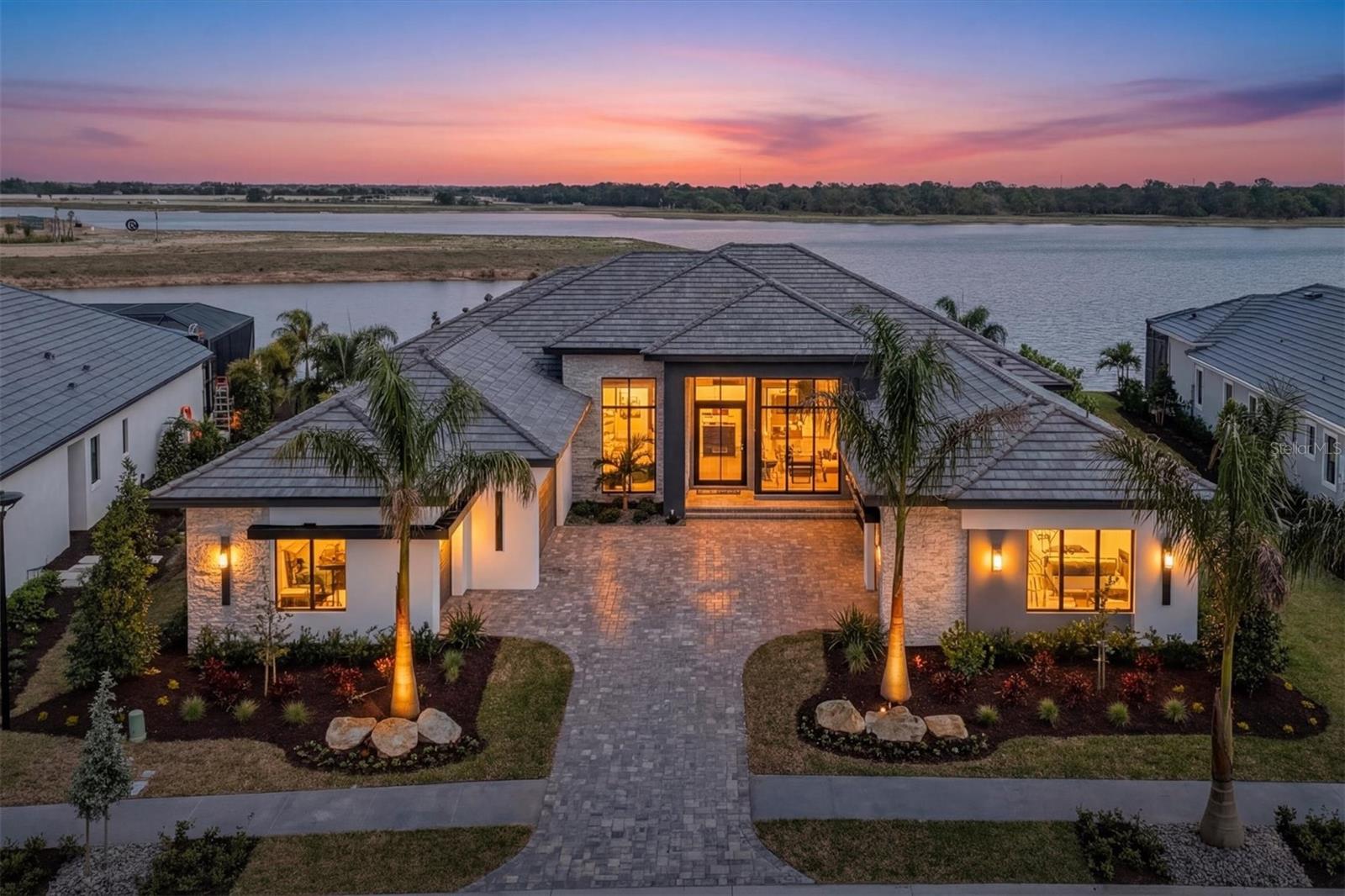 Welcome to an extraordinary opportunity to own the Pindari II model by John Cannon Homes, a fully furnished showcase residence in the coveted Wild Blue at Waterside community. Thoughtfully designed and impeccably executed, this model home is now available for purchase with a builder leaseback—offering both investment appeal and future personal enjoyment.

Every detail of this residence reflects elevated luxury, from its architectural presence to its curated interiors. The home is being offered fully furnished, with all furnishings, artwork, and accessories included—professionally selected by Clive Daniel Home—creating a seamless, turnkey experience.

Residents of Wild Blue will enjoy access to the upcoming clubhouse, designed as a central hub for lifestyle and leisure, featuring dining, a state-of-the-art fitness center, classes, personal training, a golf simulator, movie theatre, and more. In addition, the shared Midway Sports Center offers 13 acres of recreation, inviting residents to explore, play, and connect with miles of scenic preserve walking paths.

This offering represents a rare chance to own a professionally designed model home in one of the area’s most sought-after communities. List price includes all furnishings and is net of the builder leaseback. Sale is subject to builder leaseback terms.