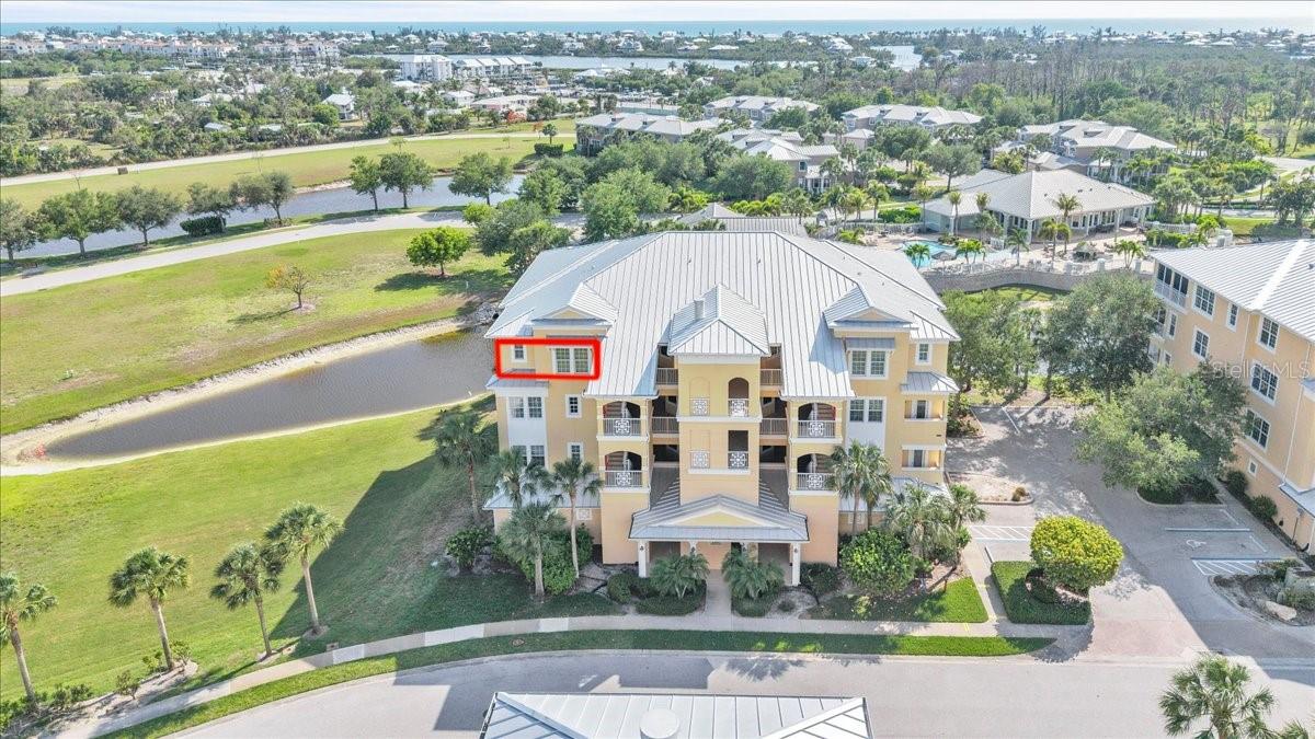 This furnished four-bedroom, three-bath third-floor corner residence presents a rare standout opportunity in today’s real estate market. Located within The Hammocks, a vibrant and highly sought-after gated community, this home offers more than just a place to live—it delivers an elevated lifestyle. Enjoy a smooth elevator ride to the third floor, where just steps from the landing you enter a light-filled sanctuary. Inside, you are immediately captivated by thoughtfully designed interiors, refined finishes, and a layout that strikes a perfect balance between sophistication and comfort. A welcoming circular foyer creates an impressive sense of arrival, with guest suites thoughtfully positioned to the left and right, offering privacy and versatility. From the foyer, the home opens seamlessly into the main living, dining, and kitchen areas, all beautifully complemented by light, wide-plank wood-look flooring that enhances the home’s bright, coastal feel and flows throughout the main living spaces. Sunlight pours through expansive windows, illuminating elegant crown molding that graces the ceilings and adds timeless character throughout. The kitchen is a true showpiece, seamlessly blending style, functionality, and connection to the surrounding living spaces. Anchored by expansive granite countertops, it features a center prep island offering built-in storage along with a convenient beverage refrigerator. Crisp cabinetry in a soft, modern palette pairs beautifully with a contemporary mosaic tile backsplash, while stainless steel appliances provide both sleek aesthetics and dependable performance. A spacious walk-in pantry closet provides organization and storage, keeping the kitchen as practical as it is beautiful. Step out onto an expansive third-floor balcony designed for effortless indoor-outdoor living. Fully covered and generously sized, this private outdoor retreat features tile flooring, recessed lighting, and multiple ceiling fans for year-round comfort. Sliding glass doors create a seamless connection to the interior, while open railings and the elevated vantage point showcase serene views of the Gulf Coast beyond. With ample space for lounging and entertaining, the balcony is ideal for morning coffee, sunset relaxation, or hosting guests while enjoying coastal breezes and scenic surroundings. Retreat to the spacious and inviting primary suite, thoughtfully designed for comfort and relaxation. This elegant bedroom features plush carpeting, abundant natural light, and private access to the outdoor balcony. The luxurious en-suite bathroom offers dual vanities with granite countertops, rich wood cabinetry, a relaxing garden soaking tub, and a separate glass-enclosed walk-in shower, creating a true spa-like experience right at home. space for lounging and entertaining, the balcony is ideal for morning coffee, sunset relaxation, or hosting guests while enjoying coastal breezes and scenic surroundings. Residents enjoy an exceptional array of amenities, including tennis courts, a resort style zero entry pool, an elegant clubhouse for gatherings, and a state of the art fitness center. A vibrant social calendar featuring activities such as yoga classes and book clubs fosters a true sense of community. With its thoughtful design, upscale features, and lifestyle driven amenities, this residence offers more than a home—it offers resort inspired living at its finest.
**PLEASE ENJOY THE 3D INTERACTIVE VIRTUAL TOUR ASSOCIATED WITH THIS LISTING**