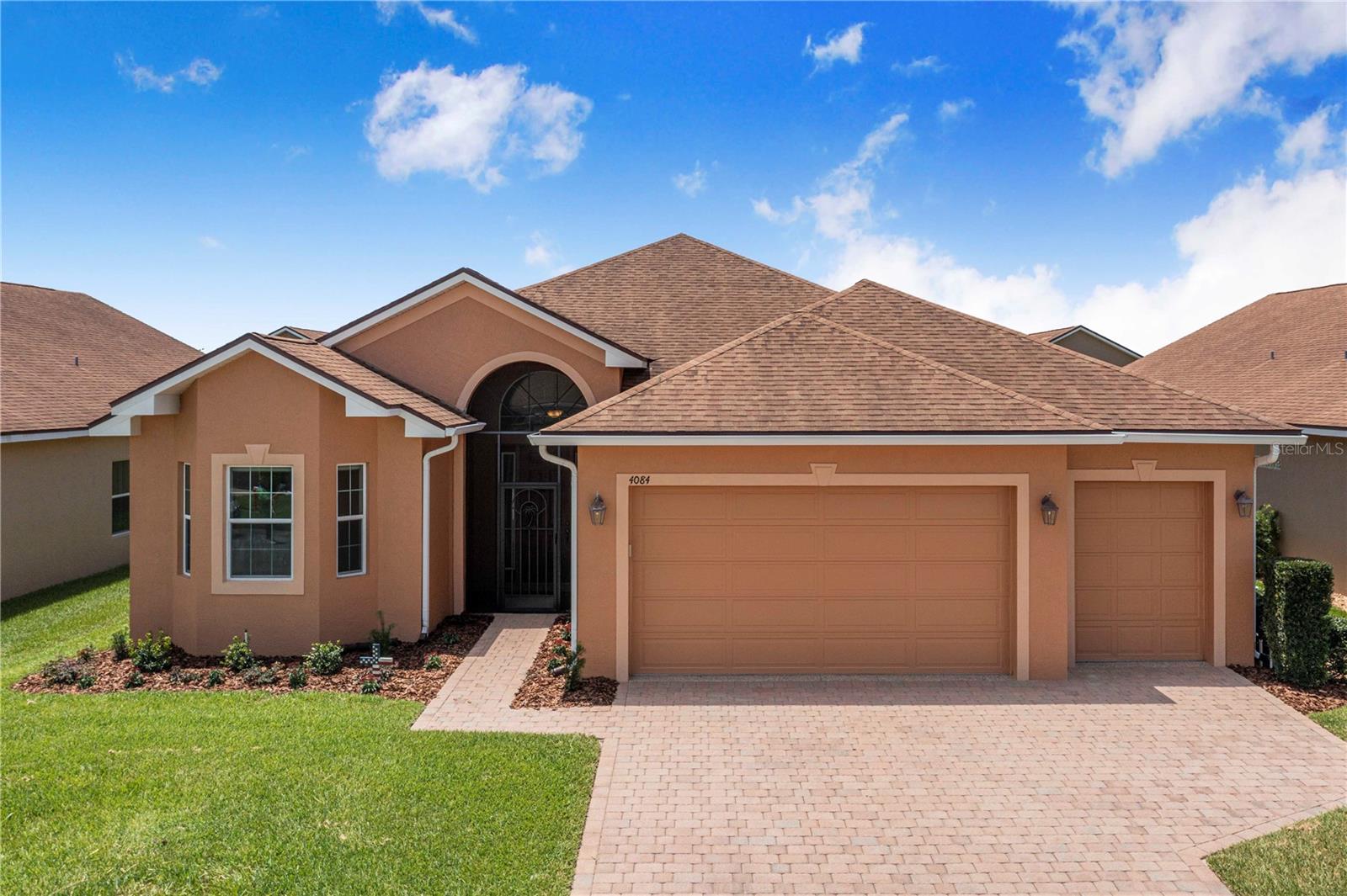 NO REMAINING CDD BALANCE—and a customized garage built for the Florida lifestyle. Welcome to 4084 Stone Creek Loop, located in the highly regarded 55+ community of Lake Ashton. This well-maintained home combines comfortable everyday living with two advantages that clearly separate it from much of the competition: the CDD assessment has already been paid in full, and the garage has been extensively customized to accommodate a boat and trailer measuring up to approximately 22 feet in overall length.

Inside, the spacious kitchen offers abundant wood cabinetry, granite countertops, stainless-steel appliances, recessed lighting, decorative pendant lights, tile flooring, and an extended breakfast bar overlooking the main living area. The open arrangement provides excellent workspace and an easy flow for entertaining family and friends.

The garage is truly one of the home’s standout features. Finished with impressive attention to detail, it includes a durable coated floor, extensive wall-mounted organization, bright overhead lighting, custom wood accents, and a specially designed recessed boat bay. Whether used for a bass boat, fishing equipment, tools, hobbies, golf-cart storage, or a serious workshop, this is the kind of space that is difficult and expensive to recreate.

At the rear of the home, a large screened lanai expands the living area and provides a comfortable place to enjoy Florida mornings, evening breezes, or relaxed gatherings. The open backyard adds a pleasant sense of space without the upkeep of a private pool.

Lake Ashton is known throughout the Lake Wales and Winter Haven area for its active-adult lifestyle, gated setting, golf, clubhouses, dining, recreation, social activities, and community atmosphere. Here, buyers can enjoy the amenities and lifestyle they are looking for while benefiting from a paid-off CDD and one of the most useful garage configurations available in the neighborhood.

This is more than another Lake Ashton home—it is a property designed for someone who wants to enjoy Florida living without giving up the boat, tools, hobbies, or storage space that make retirement fun.