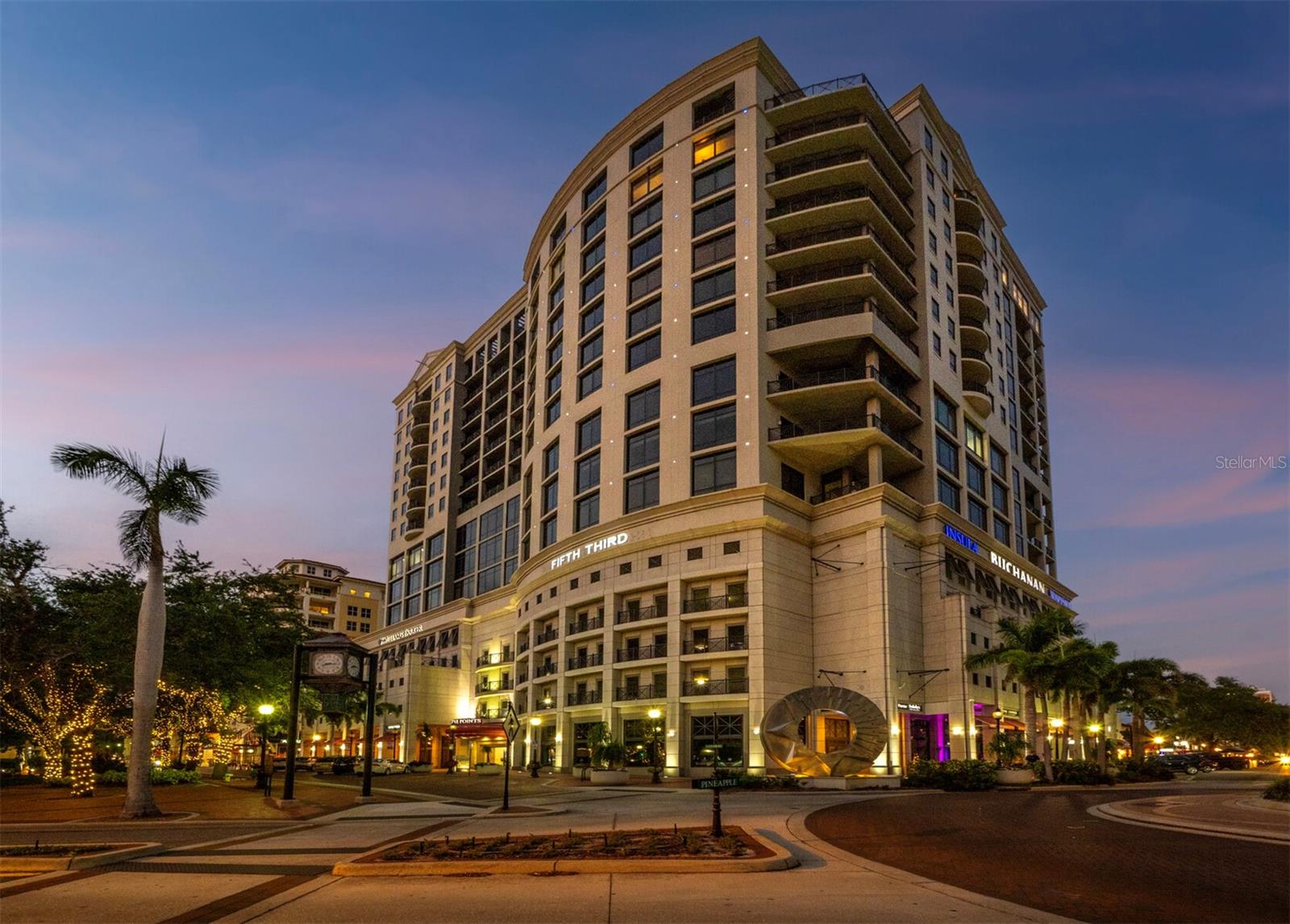 Penthouse Perfection in the Heart of Downtown Sarasota — The Plaza at Five Points Poised high above the vibrant cultural epicenter of Sarasota, this exceptionally renovated 17th-floor penthouse at The Plaza at Five Points epitomizes modern elegance and urban sophistication. Perfectly situated across from Five Points Park, The Selby Library, and the Sarasota Opera House, this distinguished residence places you steps from world-class dining, galleries, theaters, and boutique shopping. With floor-to-ceiling windows and an expansive open-plan layout, this luxurious home in the sky offers breathtaking, panoramic vistas that sweep across the city skyline, Sarasota Bay, the marina, and onward to the shimmering horizon of the Gulf of Mexico. The terrace invites tranquil mornings and unforgettable sunsets, framing the coastal beauty of Florida at its finest. Designed for both effortless entertaining and serene living, the interior boasts soaring volume ceilings and exquisite contemporary finishes throughout. The main living space is a masterclass in modern design, featuring refined stone flooring, custom built-ins, a striking marble-clad gas fireplace, and a fully integrated wet bar with stone counter and led illumination. The gourmet kitchen is a chef’s dream—adorned with new sleek cabinetry, stone countertops, cabinet paneled refrigerator and high-end stainless-steel appliances, a spacious island, large eat in area, and designer tile backsplash - all blending style with functionality. The primary suite is a private sanctuary, complete with a secluded terrace, dual luxurious bathrooms, and generous his-and-her walk-in closets. A sumptuous Jacuzzi tub, separate walk-in shower, and elegant stone finishes elevate the spa-like ambiance. Two additional en-suite bedrooms—one of which serves as a sophisticated study with built-in storage and a hidden Murphy bed—offer privacy, versatility, and guest accommodations of the highest standard. Life at The Plaza at Five Points is defined by its world-class amenities and unwavering attention to detail. Residents enjoy a private, secured lobby entrance, full-time concierge, and valet services. Socialize or entertain in the elegant club room with a fireplace and catering kitchen, hold meetings in the professional conference room, or unwind in the rooftop heated pool and spa, surrounded by expansive sun decks and covered lounging areas. Additional amenities include a fully equipped state-of-the-art fitness center, a furnished guest suite, gazebo and grill area, and a Grand Motor Court. This penthouse residence also includes two secure garage parking spaces and an oversized, climate-controlled storage unit ideally located just steps from the unit’s hallway. The pet-friendly building offers the ultimate convenience for those seeking refined urban living in one of Florida’s most sought-after coastal cities. Don't wait to build, this new apartment is ready for you. Where Sophistication Meets the Sky — Experience the Pinnacle of Sarasota Living.