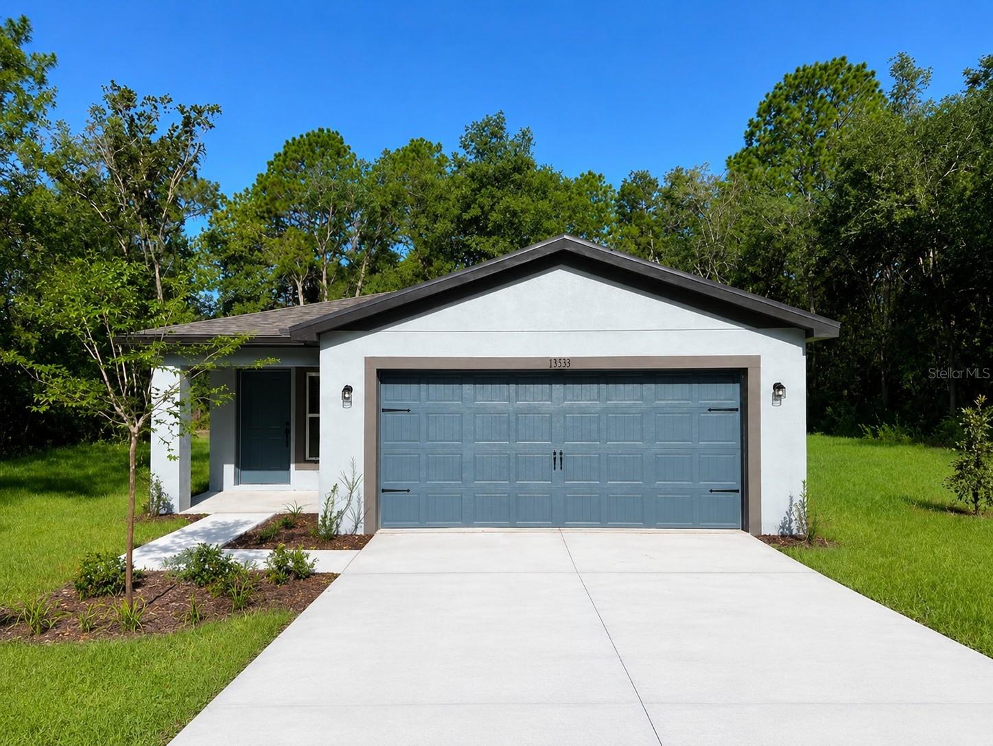 Virtually Staged. Picture this: a corner lot on nearly ¾ of an acre, tucked into the quiet charm of Weeki Wachee, Florida, the kind of space that makes you stop the car and imagine what could be.

Step through the door and the story begins. Gleaming tile floors lead you through an open, light-filled layout where every detail has already been taken care of. The kitchen is the heart of it all: rich granite countertops, a complete stainless appliance package, and plenty of room to gather, cook, and make memories, all ready and waiting for you from day one.

Three comfortable bedrooms offer rest and privacy, while two full baths keep mornings simple. A two-car garage adds everyday convenience, and outside, that oversized corner lot unfolds like a blank page; space for a garden, a workshop, a pool, or simply room to breathe, all just minutes from Weeki Wachee's natural springs.

This isn't just a house, it's a fully upgraded, move-in-ready home offering rare land and unmatched value in today's market. Homes like this, on a lot like this, with everything already done? They don't come around often.

Come see it before someone else writes the next chapter.