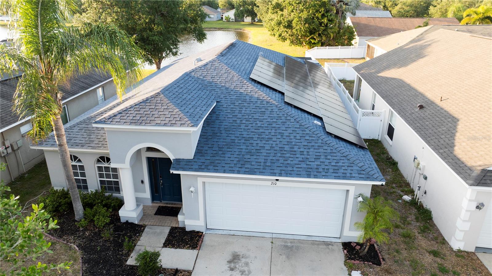 WELCOME HOME TO WATERFRONT FLORIDA LIVING WITHOUT THE WATERFRONT PRICE TAG!

If you're searching for a move-in-ready home that offers space, comfort, and exceptional value, 210 Smokey Hill Avenue deserves a spot at the top of your list. Priced at $365,000, this beautifully maintained 4-bedroom, 2-bathroom home offers 2,010 square feet of thoughtfully designed living space, a 2-car garage, and one of the most impressive outdoor living areas you'll find in this price range.

Imagine starting your mornings overlooking peaceful pond views and ending your evenings entertaining family and friends on the massive 1,000-square-foot screened lanai. Whether you're hosting game days, backyard barbecues, holiday gatherings, or simply enjoying Florida's beautiful weather, this home was designed for making memories.

Inside, the open-concept layout keeps everyone connected. The spacious eat-in kitchen features granite countertops, abundant cabinetry, and overlooks the living area, ensuring you'll never miss a conversation while preparing meals or entertaining guests.

The private primary suite is the perfect retreat, complete with a walk-in closet and an en suite bathroom featuring a relaxing soaker tub and separate shower. Three additional bedrooms provide plenty of space for family, guests, a home office, or hobbies.

Even better? The solar panels will be PAID OFF at closing, giving the new owner the benefit of energy efficiency and potentially lower utility costs from day one—without taking on an additional loan payment.

Located just minutes from shopping, dining, entertainment, schools, and major commuter routes, this home offers the perfect balance of convenience and tranquility.

Homes offering this much space, outdoor living, and energy-saving features at $365,000 are becoming increasingly difficult to find. Schedule your private showing today before someone else calls it home.