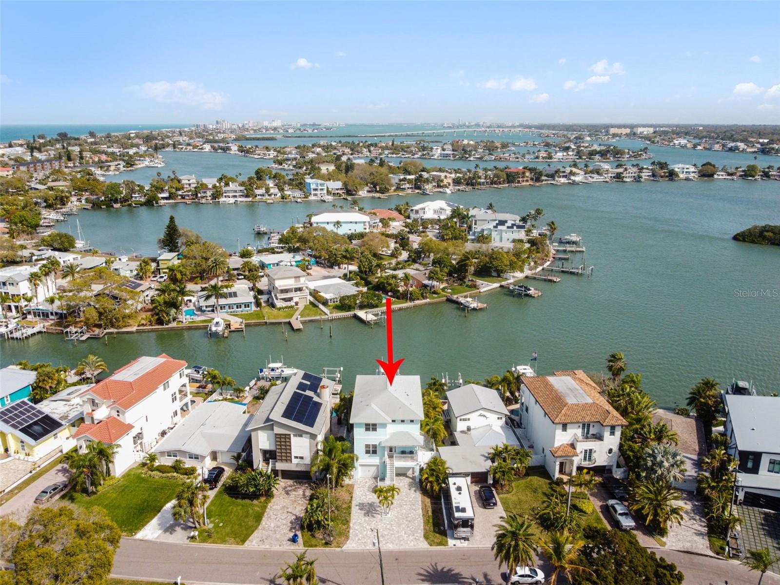 GULF OF MEXICO DIRECT ACCESS !!!  WATERFRONT POOL HOME … with 20,000lb BOAT LIFT!!   ELEVATOR  &  4 CAR GARAGE!!!   Indian Rocks Beach exclusive single family home hits the market!     Coastal style home built in 2017....SOLD FULLY FURNISHED!!   Two grand balconies with breath-taking water views!  Fabulous open concept floor plan with spacious living space … great for entertaining!  Electrical motor shades installed throughout … simple touch of a remote button to feel the FLORIDA SUN!   Gourmet kitchen , double ovens, stainless steel appliances,  walk in pantry and solid wood cabinetry!   Bonus bar seating to accommodate over 10 guests & over sized dining kitchen space to comfortably seat a table for 16 guests!   SENSATIONAL ENTERTAINING HOME!   Bring the entertainment to your over-sized balcony!   Plentiful outdoor seating and space to enjoy the amazing Florida sunsets or sunrises!  Spiral metal staircase leading to your tropical outdoor oasis!!   Dazzling in ground pool dressed with beautiful custom pavers!  24 hour easy access to the GULF OF MEXICO!  Newly installed 20,000 lbs. boat lift included!   Enjoy the marine life while sipping on your favorite cocktail!  Swimming , fishing, jet skiing, boating, scuba diving ….enjoy the SALT LIFE!  Bonus outdoor shower !   This Indian Rocks Beach powerhouse of home has incredible 4 car garage !  Plenty of garage space for golf cart, jet skies, bikes, motorcycles, collectible automobiles and of course your FLORIDA CONVERTIBLE sports car!!!   BONUS front driveway with space to park your RV or boat!    Primary retreat has access to your very own 3rd floor balcony to enjoy those magical Florida evenings with someone special.   Magnificent water views!!  Custom glass shower stall and double vanities with custom mirrors and light fixtures!  Luxurious elevator with custom wainscoting...easy glide to floors 1, 2 ,3!  Front loading washer and dryer convey!  Plentiful of interior extra linen and storage closets!  Indian Rocks Beach is located on a barrier island on the West Coast of Florida, only a 30 minute drive from Tampa International Airport.  Incredible wide sandy beaches and convenient proximity to many Florida Attractions including Busch Gardens, Walt Disney World, Universal Studio, and Sea World, as well as the cities of Clearwater, St. Petersburg, and Tampa.  Home highlights:  GULF OF MEXICO DIRECT ACCESS , WATERFRONT,  POOL , ELEVATOR ,  4 CAR GARAGE and  20,000lb BOAT LIFT!!!!!    LIVE THE FLORIDA DREAM!!   ****ONLY $700 a year for flood insurance    &   SHORT TERM RENTAL OKAY!!!