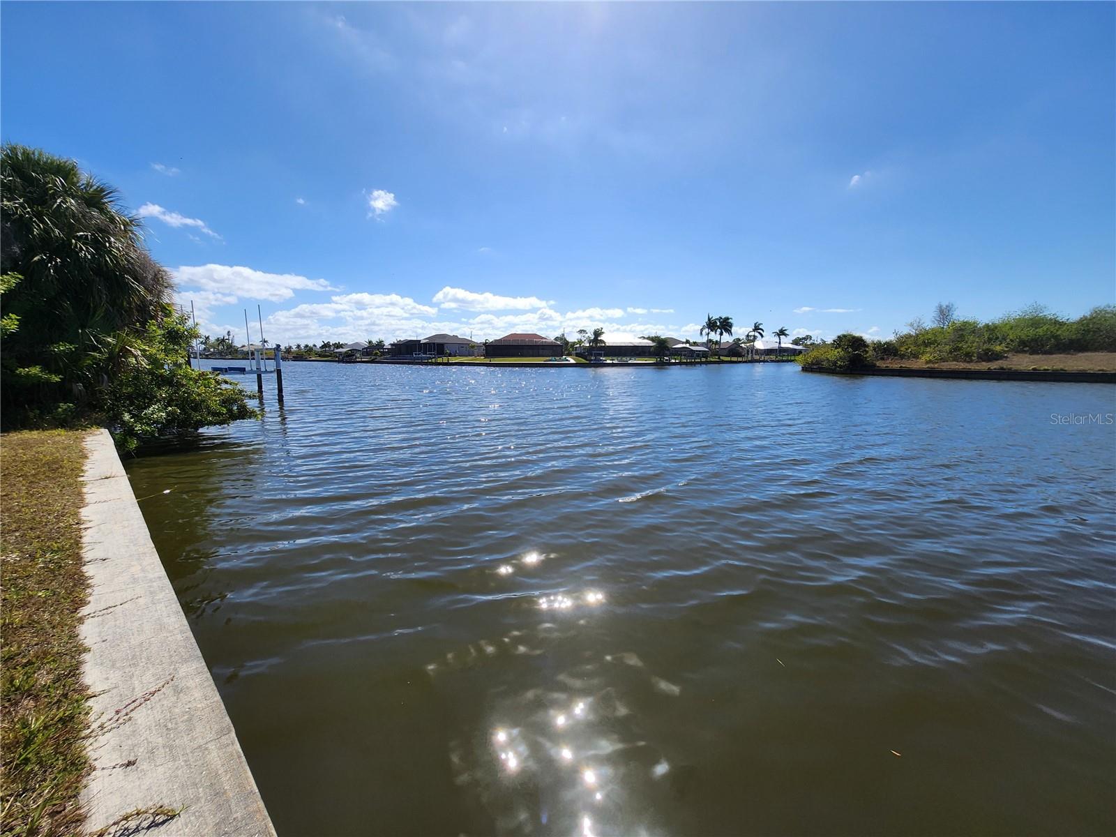 Located on the Zephyr Waterway in the highly desirable waterfront community of South Gulf Cove, this exceptional homesite offers the perfect setting to build your Florida dream home. With sought-after southern rear exposure, you’ll enjoy sunshine on your future pool all day long and breathtaking sunsets in the evening.

The extra-wide waterway provides an expansive water view and added privacy, creating generous distance between you and neighboring homes — a rare and valuable feature for waterfront living. Whether you're planning a custom estate or a seasonal retreat, this lot offers the ideal combination of space, light, and tranquil surroundings.

South Gulf Cove is a growing waterfront community featuring public water and sewer, neighborhood parks, sidewalks, and a voluntary HOA. Boating enthusiasts will appreciate access to over 50 miles of navigable canals with connectivity to Charlotte Harbor and the Gulf of Mexico. Conveniently located near beaches, golf courses, shopping, and dining, this is a prime opportunity to invest in one of Southwest Florida’s most popular waterfront communities.