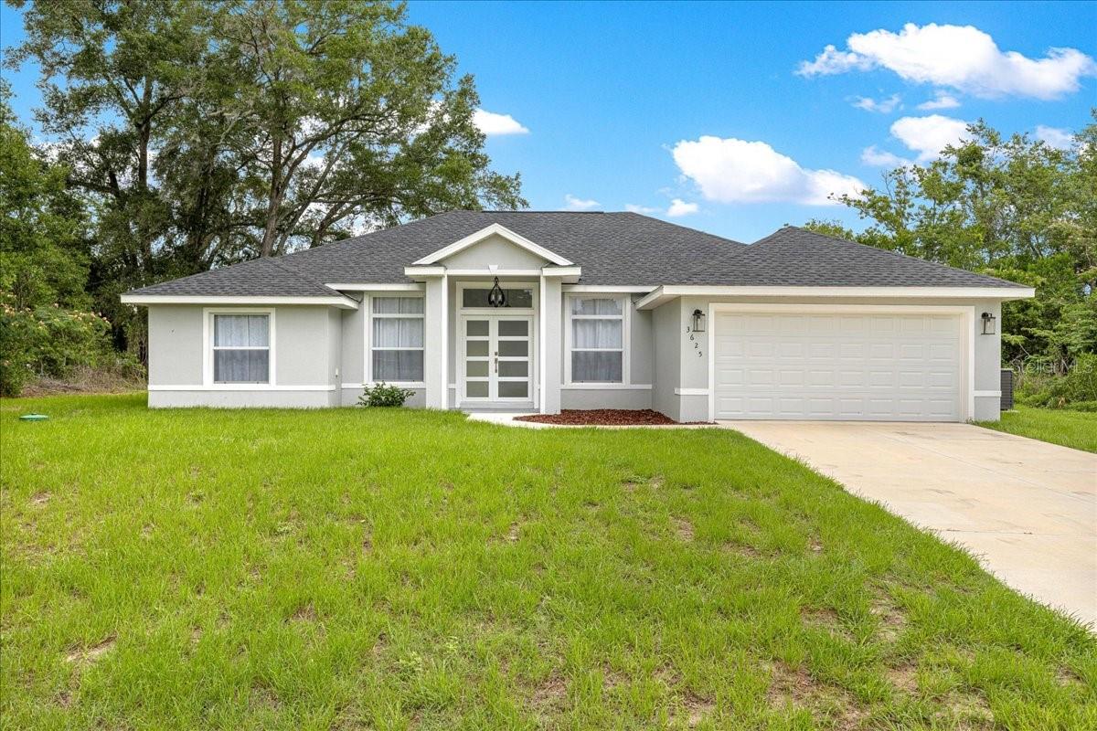 Built in 2025 and thoughtfully upgraded beyond standard new construction, this move-in ready 3-bedroom, 2-bath home offers 1,778 living square feet with no HOA, no CDD fees, and the freedom to enjoy the property as you choose. Inside, elegant porcelain tile flooring flows throughout the home, creating a seamless and low-maintenance living environment with no carpet. The open-concept design is enhanced by ceiling fans throughout, custom floor-to-ceiling drapery, and upgraded glass shower enclosures that add a clean, modern touch.
The kitchen is fully equipped with a matching Samsung appliance package, including the refrigerator, oven, microwave, and dishwasher, allowing you to move in and enjoy the home from day one.
Additional upgrades include a premium whole-house iron filtration and water softener system designed specifically for well water, providing enhanced water quality throughout the home. The garage is equipped with a Tesla EV charging station, already installed and ready for use.
Set on a spacious 0.32-acre homesite, the property offers a level of privacy rarely found in newer construction, with no neighbors on either side and only one neighboring home behind. The generous lot provides ample space for pets, outdoor living, gardening, or future improvements.
Conveniently located with easy access to Highway 484, Highway 301, and Interstate 75, this home offers the perfect balance of privacy and accessibility while remaining close to shopping, dining, medical facilities, and everyday conveniences.
As an added bonus, the seller is offering up to $7,000 toward buyer closing costs or to be applied toward a 2-1 interest rate buydown for qualified buyers, helping make homeownership even more affordable.
Why wait for new construction and pay for upgrades later? Many of the upgrades buyers typically add after closing are already in place, making this home a truly move-in ready opportunity.