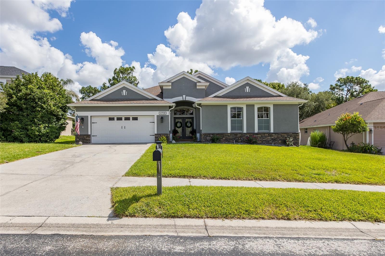 Welcome to this exceptional 4-bedroom, 3-bathroom, 2-car garage home located in the highly sought-after Amersham Isles gated neighborhood of Sterling Hill. Thoughtfully designed with an open-concept floor plan, this home offers the perfect blend of comfort, functionality, and style. The heart of the home is the beautifully appointed kitchen, featuring granite countertops, stainless steel appliances, abundant cabinet space, and a custom-built window bench seat, creating the perfect spot to enjoy your morning coffee or gather with family and friends. The spacious kitchen overlooks the living and dining areas, making entertaining effortless. A desirable split-bedroom layout includes a guest bedroom with its own private en-suite bathroom, providing comfort and privacy for guests or multigenerational living. The oversized primary bedroom boasts a large walk in closet, en suite bathroom with large soaking tub, separate shower, double sinks with granite countertops and under-mount sinks, and private toilet room. Step outside to your own private backyard retreat, where the spectacular inground pool is the centerpiece. Complete with bubblers, four water fountains, a cascading waterfall, and a fire bowl, this outdoor oasis is designed for year-round enjoyment. The home also backs up to a protected conservation area, offering peaceful views and added privacy with no rear neighbors. Additional updates and features include a new A/C installed in 2021, a new water heater in 2023, EV charging hookups, and tile flooring in the garage, adding both convenience and value. Residents of Sterling Hill enjoy an impressive selection of community amenities, including multiple pools, parks, basketball courts, a dog park, and a splash pad. Conveniently located near the Suncoast Parkway, as well as shopping, dining, and top-rated schools, this home offers the ideal combination of luxury, convenience, and Florida living. Don't miss your opportunity to own this beautifully maintained home in one of the area's most desirable communities—schedule your private showing today!