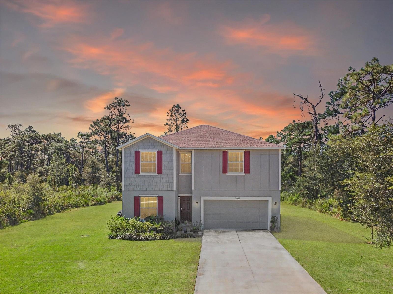 ***PASSED INSPECTIONS & APPRAISAL!***Sellers Highly Motivated! Welcome to your dream home in the peaceful community of Indian Lake Estates, FL! This 4-bedroom, 3.5-bath residence offers the perfect blend of modern luxury and everyday comfort, ideally located just off Hwy 60! Get away from the noise and enjoy easy living with Luxury, Comfort & Privacy! NO HOA restrictions! Step inside to an inviting open-concept floor plan featuring soaring ceilings, storm-grade windows, and thoughtful upgrades throughout. A formal dining room and versatile bonus room/office provide space for entertainment, remote work, or a creative studio. The natural light-filled great room flows seamlessly into the kitchen, complete with state-of-the-art stainless-steel appliances, sleek gray floating cabinets, and quartz countertops surrounding a spacious island—perfect for family gatherings and entertaining. The living room opens to a large, screened lanai overlooking wooded views with no rear neighbors, offering tranquility, privacy, and the perfect setting for outdoor living. Upstairs, the private primary suite serves as a retreat with dual walk-in closets, a quartz-topped dual-sink vanity, and a walk-in shower. Three additional bedrooms and two secondary bathrooms provide ample space for family or guests. Additional highlights include ceramic tile throughout the main floor, carpeted bedrooms, a full-sized laundry room, metered irrigation, and smart, stylish finishes. Living in Indian Lake Estates means enjoying exceptional amenities: Lake Walk-in-Water access for boating and fishing, golf, clubhouse, café, fitness center, playground, nature trails, tennis, and basketball courts. You’ll love the balance of quiet neighborhood charm with convenient access to top-rated schools, shopping, dining, theme parks, beaches, and the Tampa-Orlando corridor. with easy access to local attractions like Bok Tower and the Westgate River Ranch Resort. Don’t miss this rare opportunity to own a luxurious home in one of Indian Lake Estates’ most desirable and up and coming communities. Schedule your private showing today!