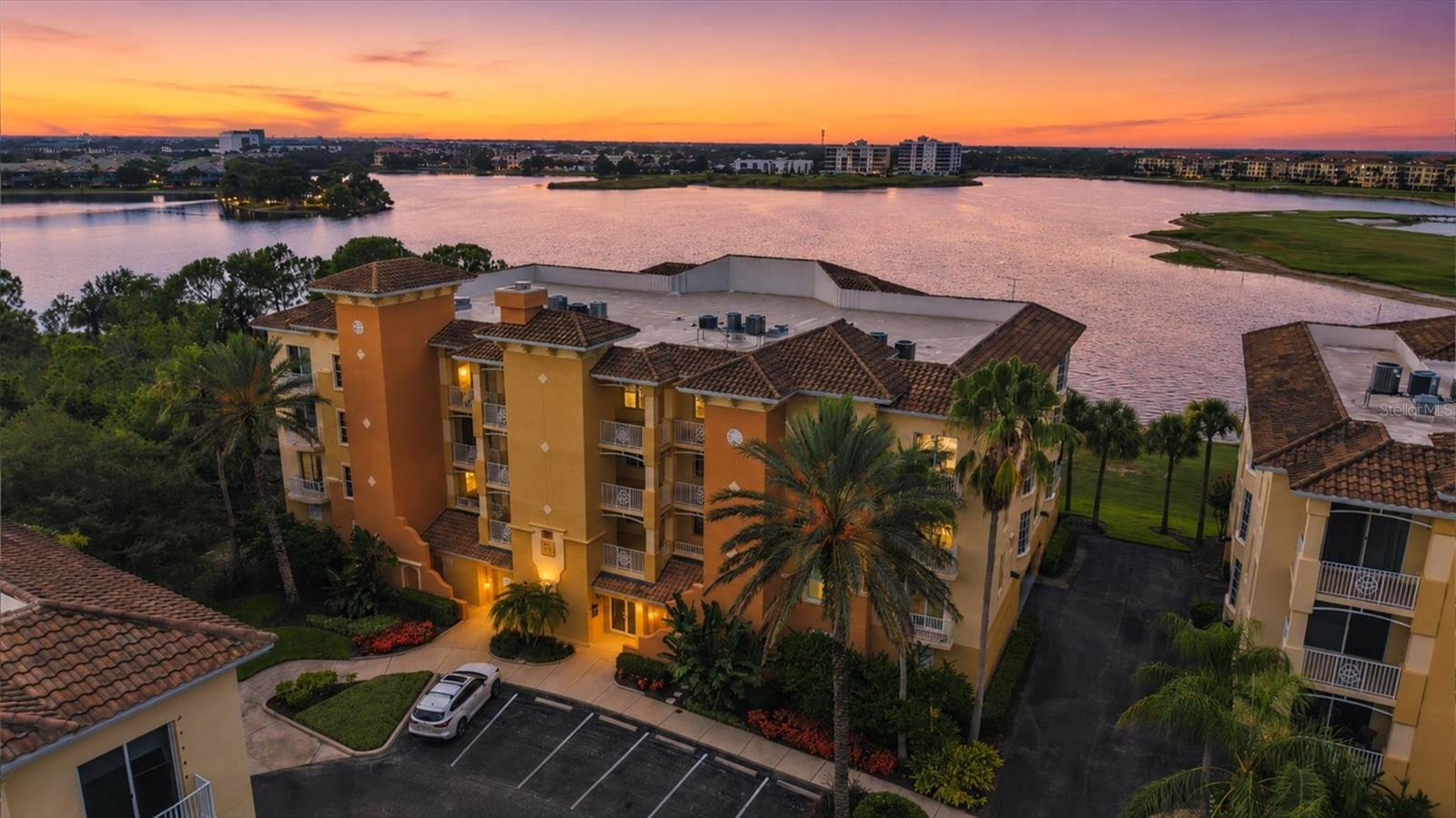Perched on the top floor you get sweeping water and downtown views, this beautifully updated 3-bedroom, 2-bath condo at Watercrest is the Lakewood Ranch lifestyle at its finest. Enjoy a glass of wine with the sunset views over beautiful Lake Uihlein and skyline of downtown Lakewood Ranch from your private balcony and enjoy true peace of mind with a rare full two-car garage for under-building parking — a sought-after feature in this community. Inside, the kitchen shines with brand-new cabinetry and updated light fixtures (2025), complemented by fresh paint and carpet, updated hall lighting, and Hunter Douglas Vertiglide shades. Recent upgrades include a new washer/dryer (2024), new toilets (2023), a new water heater (2026), and a new garage door (2026), so the big-ticket items are already done. The heated, resurfaced community pool and resort-style amenities are just steps away, all backed by an HOA that covers water, sewer, pest control, grounds and structure maintenance, and more. Pet-friendly with flexible leasing (90-day minimum) — a rare combination of low-maintenance living and an unbeatable view.