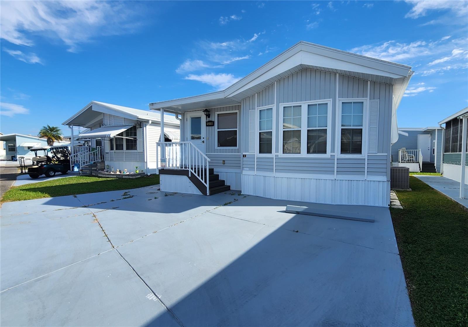 CHARIOT MOBILE HOME IN ACTIVE 55+ COMMUNITY! One bedroom, 1 1/2 bath turn-key home. There is a comfy living room, family room, & eat-in kitchen with built-in storage. Home has a beachy cottage feel. Unique drapery installation allows family room with sofa bed to be enclosed, providing privacy for overnight guests. Beyond the drapes is a bonus area which could be used as a small office, extra storage, or a craft area. All appliances included. Inside laundry. The bedroom has built-in storage, a vanity area, and an en suite bathroom with tub/shower.  Central A/C (2014). Membrane roofover (2019). All the plumbing was updated in 2013. Priced to sell and seller will give a $5,000 credit at closing for home updates. SUGAR CREEK COUNTRY CLUB CO-OP HAS LOW HOA FEES of just $600 quarterly which includes water, trash, sewer, basic cable, internet, and grass mowing.  There are two swimming pools, heated spa, clubhouse, tennis, pickleball, shuffleboard, a fitness room, and workshop. There is an active social calendar with fun activities and outings during the winter months. Enjoy this community's proximity to the Braden River and River Links Golf Course. Sorry this is not a dog lot.