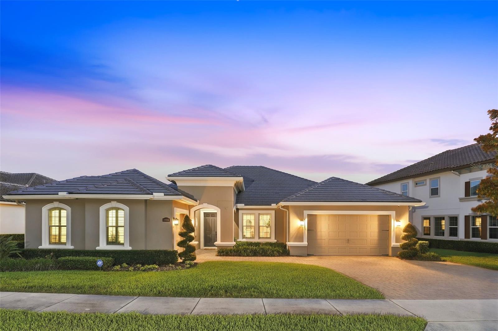 Welcome to this exceptional waterfront home, perfectly positioned within Steeple Chase, one of Lake Mary's most prestigious gated communities. With just 142 residences, Steeple Chase is surrounded by lush greenery, serene lakes, and direct access to the Seminole Wekiva Scenic Trail, ideal for walking, jogging, and cycling enthusiasts alike. Built by Taylor Morrison, the Cordova floorplan offers a seamless blend of elegance and everyday comfort. It features 4 spacious bedrooms, 3 elegant bathrooms, dedicated formal living and dining spaces, a private office/den with custom maple built-ins and a granite workspace, a 3-car garage, and 3,286 square feet of expertly designed living space. Complementing the home's elegant interior is a private waterfront oasis featuring a screened-in saltwater pool and a fully equipped outdoor kitchen designed for effortless entertaining. Upon entry, a grand foyer floods with natural light and immediately draws your eye to breathtaking water views beyond. Thoughtfully appointed throughout, the home showcases numerous premium finishes and designer touches. Standout features include upscale tile flooring, custom wood plantation shutters, a motorized roller shade on the living room sliders, tray ceilings, and custom closets in every bedroom. Recent 2026 improvements include fresh interior paint, professionally painted kitchen cabinetry, new light fixtures, brand-new appliances (except refrigerator), a new pool heater, and additional enhancements. At the heart of the home is a beautifully appointed gourmet kitchen featuring dual islands with striking stone countertops, including one with bar seating. It is complemented by upgraded 42-inch white cabinetry and top-of-the-line GE stainless steel appliances, including a built-in refrigerator, built-in microwave, microwave/convection oven combo, vent hood, Energy Star dishwasher, and a 5-burner gas cooktop. The owner's suite offers a private retreat, featuring a spa-like en-suite bath with a soaking tub, separate walk-in shower, dual split vanities, and generously sized walk-in closets fitted with custom shelving and drawer systems. Three additional guest bedrooms provide ample space, comfort, and privacy for family or visiting guests. Designed for year-round entertaining, the outdoor living area showcases sweeping water views from the screened-in saltwater pool, complete with a natural gas heater for enjoyment in every season. The fully equipped outdoor kitchen, featuring a built-in grill, griddle, drawers, dual-motor exhaust fan, and a glass block back wall, creates the perfect setting for unforgettable weekend gatherings and relaxed poolside entertaining. Energy efficiency is also a priority here, with a tankless gas water heater and double-pane windows to reduce energy consumption. Meticulously cared for throughout, this property checks every box for luxurious, modern living. Steeple Chase is conveniently located near upscale dining, shopping, and entertainment, with easy access to I-4, SR 417, SR 429, Downtown Orlando, area attractions, and Florida's beautiful Atlantic beaches. Offering an exceptional blend of luxury, comfort, and location, this remarkable waterfront residence is ready to welcome its next owner. Schedule your private tour today and discover luxury waterfront living at its finest. A transferable home warranty is included for added peace of mind. Please note: Audio/visual surveillance may be active on this property.