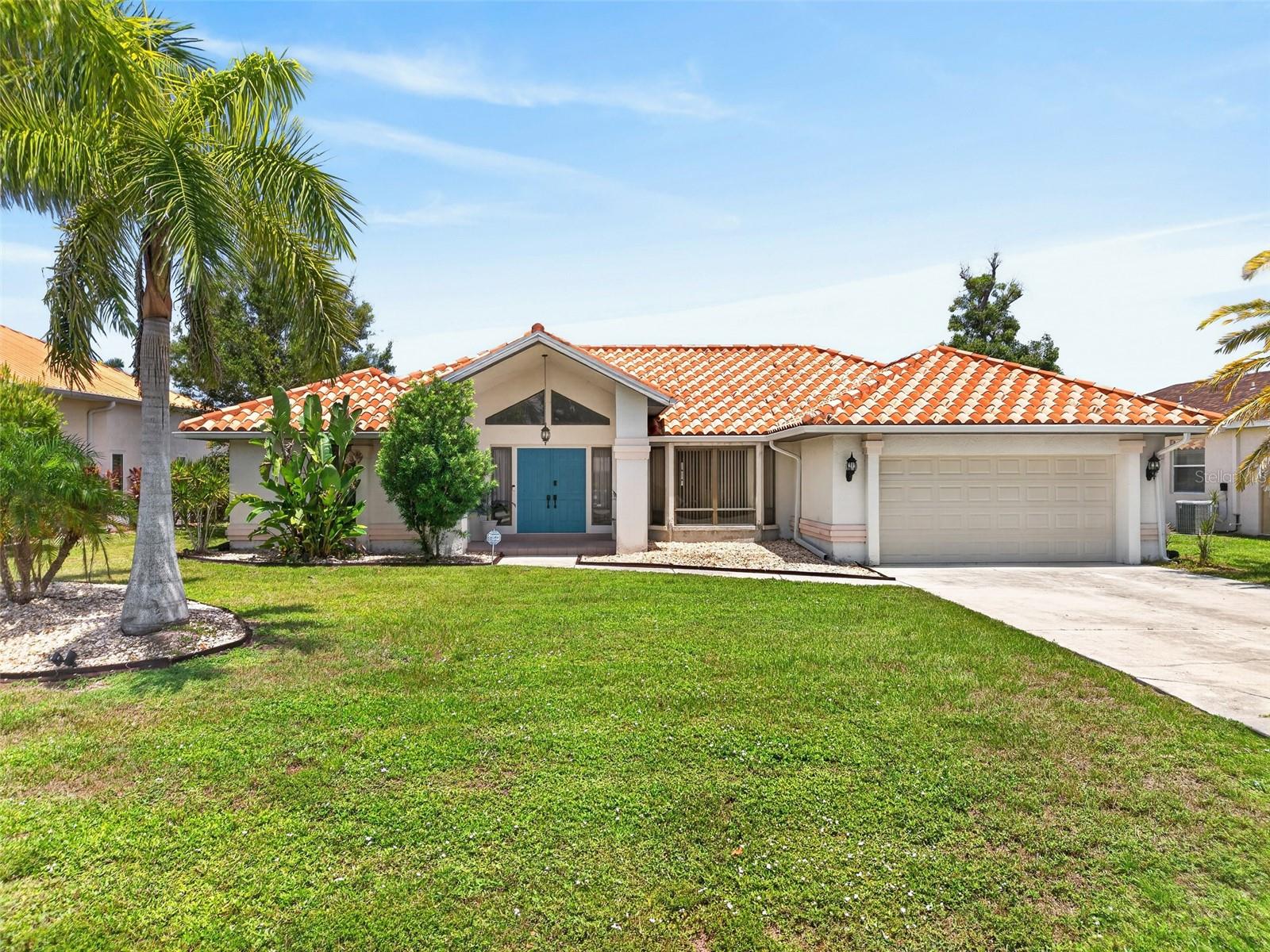 Contemporary style defines this recently remodeled 3 bedroom, 3.5 bath, 2-car garage pool home in the highly desirable deed restricted community of Deep Creek! High-end details and stylish features make this home truly amazing including luxury vinyl flooring throughout, modern lighting and fixtures, updated kitchen highlighting stone counters, beautiful tile backsplash, upgraded stainless appliances and convenient center island. Bedrooms are a private retreat each with their own ensuite bath. Generous primary suite offers access to lanai and luxurious spa inspired ensuite with dual sinks, stand-alone soaking tub and glass-enclosed walk in rain shower. Split floor plan provides plenty of privacy for guests featuring two great sized bedrooms with custom remodeled baths. Step inside to a spacious floor plan featuring 2,277 sf of living space with high ceilings, transom windows, pocketing sliders to lanai, formal dining area and family room overlooking pool – a great space to entertain family and friends. Step outside to a covered lanai, stamped concrete deck, screened heated pool and large fenced backyard with greenbelt views for added privacy plus true eastern exposure to enjoy amazing sunrises. Additional features include inside laundry, new garage door (2023), hot water heater (2020), and mature tropical landscaping. Move-in-ready and nestled in a quiet and friendly neighborhood conveniently located close to I-75, restaurants, shopping, schools, parks, golf and just a short drive to downtown historic Punta Gorda, known for its world-class fishing and boating, community events and entertainment. Don’t miss this opportunity! Schedule your private showing today!