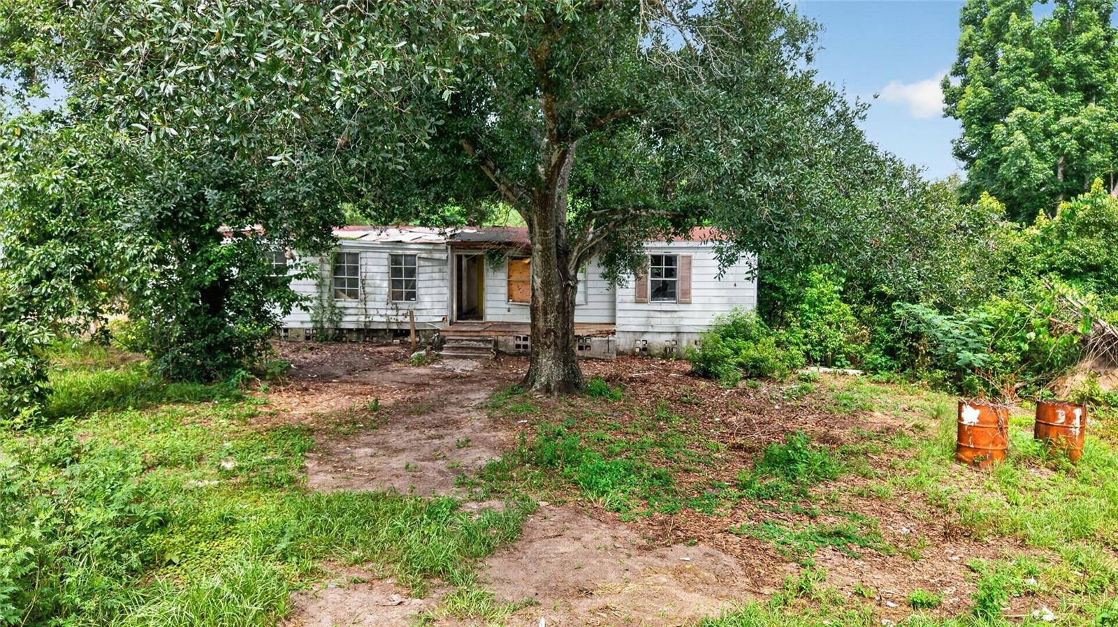 HANDYMAN SPECIAL on 2 acres with NO HOA and NO lot rent! Bring your vision and unlock the potential of this unique property at 8608 Hamster Drive in Zephyrhills. Situated on an oversized 2-acre parcel, this fixer-upper offers the rare opportunity to create your ideal homestead, investment property, or renovation project while enjoying the freedom and privacy that acreage provides. The existing home is ready for updates and improvements, making it a great opportunity for investors, flippers, or buyers looking to put their personal touch on a property with incredible upside. A major bonus is the RELATIVELY NEW WELL already located on the property, adding value and helping reduce future improvement costs. With 2 acres of land, there is plenty of room for additional outbuildings, workshops, recreational vehicles, animals, gardens, or simply enjoying the extra space and privacy. Best of all, there are no HOA fees and no monthly lot rent, allowing you to truly use the property the way you choose without added restrictions or recurring community costs. Located in the growing city of Zephyrhills, you'll enjoy a charming small-town atmosphere with convenient access to shopping, dining, medical facilities, and everyday essentials. The area is known for its beautiful countryside, outdoor recreation, and easy access to major roadways connecting you to Tampa, Wesley Chapel, and surrounding communities. Zephyrhills continues to attract buyers seeking more space, affordability, and a relaxed Florida lifestyle while remaining close to modern conveniences. Whether you're searching for your next renovation project, an investment opportunity, or a property with room to grow, this 2-acre fixer-upper offers endless potential in an increasingly desirable area. Schedule your showing today and imagine the possibilities!!!!