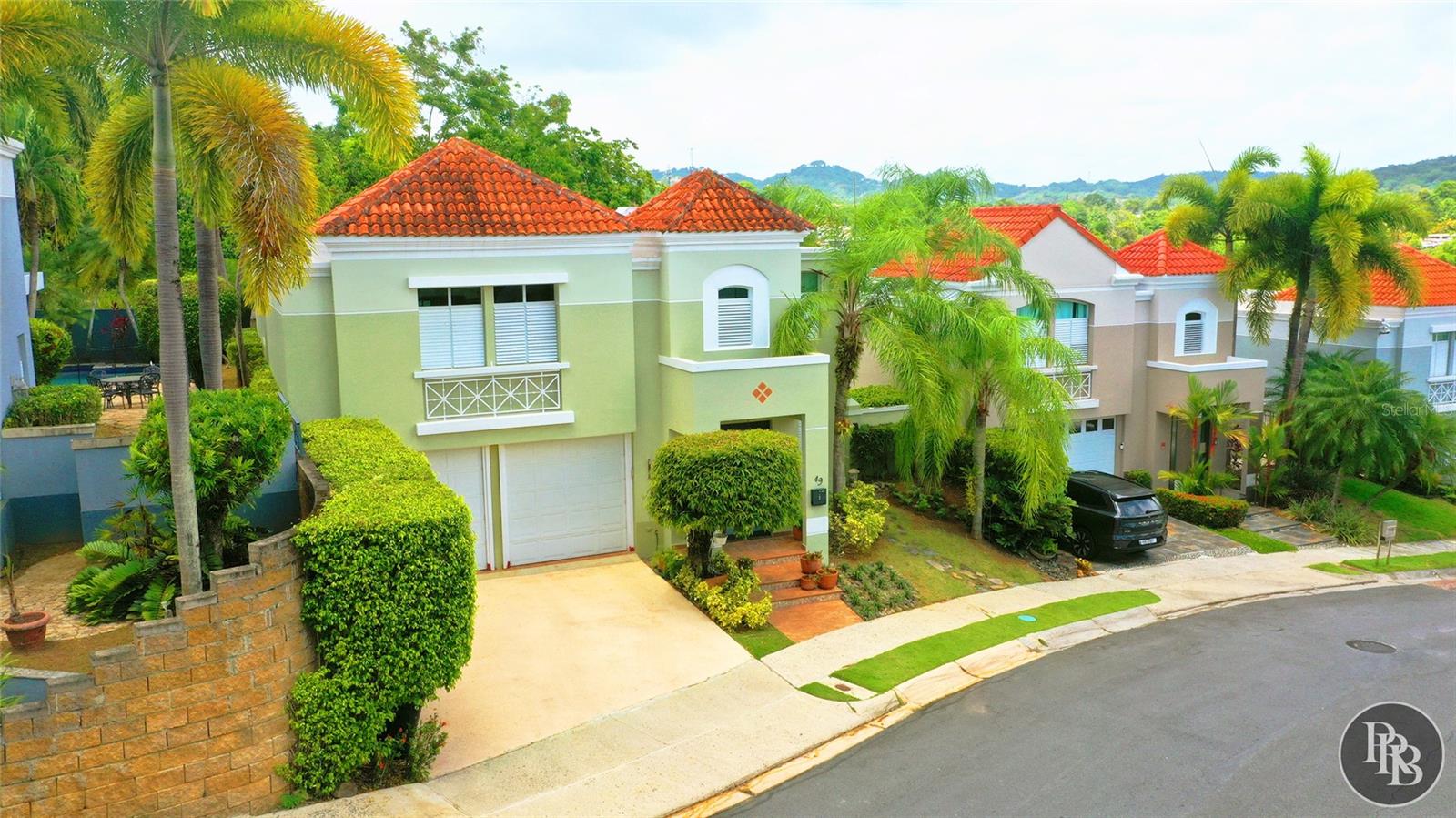 Experience the perfect blend of comfort, privacy, and Caribbean living in this beautiful residence located in the desirable Monte Verde Real gated community. This thoughtfully designed home features soaring double-height ceilings, abundant natural light, spacious living areas, and an inviting open layout perfect for everyday living and entertaining.

The remodeled kitchen serves as the heart of the home, showcasing granite countertops, a center island, stainless steel appliances, and elegant cabinetry, creating a stylish and functional space for family gatherings.

Step outside and enjoy a private tropical retreat featuring a pool, covered terrace, decorative fountain, stone decking, and lush landscaping. The outdoor spaces provide the ideal setting to relax, entertain guests, and embrace Puerto Rico’s year-round lifestyle.

Monte Verde Real offers a secure and welcoming community lifestyle with 24-hour guard service and amenities including tennis courts, clubhouse, fitness facilities, playground, community pool, and recreational areas. Conveniently located with access to PR-199, this home provides easy connectivity to schools, healthcare, shopping, dining, and premier destinations throughout San Juan, including Plaza Las Américas and The Mall of San Juan.

A unique opportunity to enjoy elegant interiors, resort-style outdoor living, and the comfort of one of San Juan’s most established residential communities.