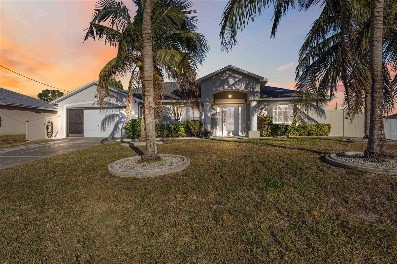Welcome to this beautifully updated pool home in the heart of Cape Coral, offering space, comfort, and Florida living at its best. Freshly painted throughout, this move-in-ready residence feels light, bright, and welcoming from the moment you arrive.

Inside, the open and flexible floor plan features multiple living and dining areas, perfect for everyday living or entertaining. The kitchen is crisp and clean with white cabinetry, ample counter space, and a layout that flows seamlessly into the main living areas. Large tile flooring throughout keeps the home cool and low maintenance.

The primary suite is generously sized and designed as a true retreat, complete with a stunning renovated bathroom featuring a large walk-in shower, dual vanities, and modern finishes. Additional bedrooms are well-proportioned and offer flexibility for guests, a home office, or hobbies.

Step outside to your private screened lanai and sparkling pool, ideal for relaxing afternoons, weekend gatherings, or enjoying Florida’s year-round sunshine. The fenced yard provides privacy, while the spacious pool deck offers plenty of room for lounging and entertaining.

Additional highlights include an interior laundry room with storage, ample closet space, and a layout that feels both open and functional. Conveniently located near shopping, dining, schools, and major roadways, this home combines comfort, style, and location.

Homes that are freshly updated, well laid out, and truly move-in ready are hard to find. Schedule your private showing today and see why this Cape Coral home stands out.