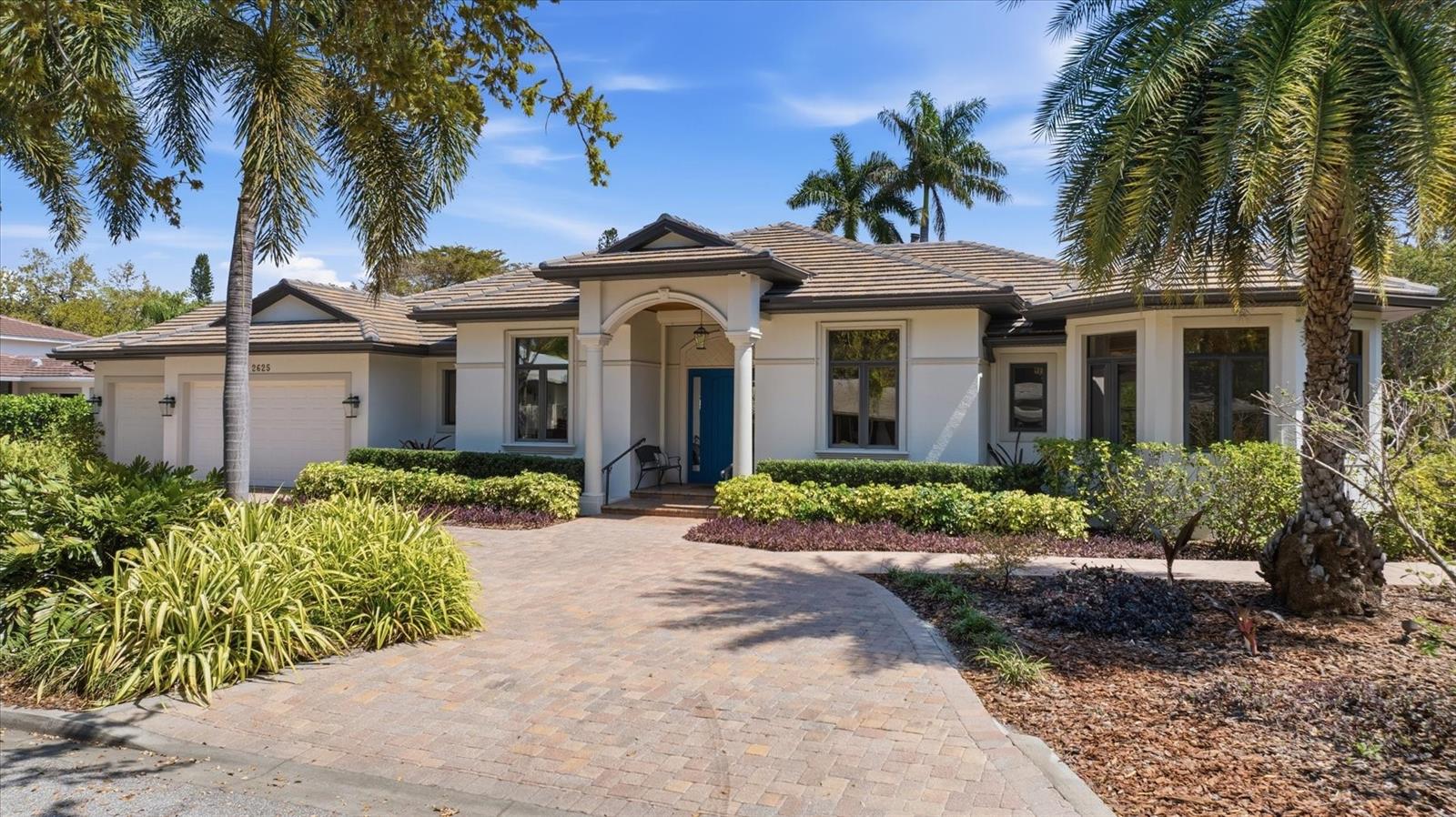 Upon entering this impeccably crafted residence, you are immediately greeted by a refined level of finish and thoughtful design. Rich hardwood flooring flows seamlessly throughout the main living areas, complemented by intricate custom millwork, elegant moldings, and double tray ceilings that enhance the home’s architectural character. Designed with intention, this 4-bedroom, 4-bath residence—featuring two bedrooms currently utilized as a den and one as a sitting room—along with a versatile bonus room ideal as a fifth bedroom, office, or private gym, offers effortless single-level living with an exceptional sense of space and functionality. As you enter, a formal sitting area anchored by a detailed fireplace creates an inviting first impression, complemented by an adjacent dedicated dining room and an elegant wet bar—perfect for entertaining. The kitchen is a true statement of both style and function, featuring artisan granite, two expansive islands offering generous space for cooking, gathering, casual seating, and designer backsplash detailing. A full suite of top-tier stainless steel appliances, including dual Liebherr refrigerators, an induction cooktop, and a built-in oven and microwave, is seamlessly integrated. Reverse osmosis filtration at the sink, along with a whole-house water filtration system, enhances everyday living. The spacious family room is designed for comfort, offering expansive views of the pool and lush Florida-native landscape, creating a seamless indoor-outdoor living experience. The primary suite is a luxurious private retreat, offering direct access to the pool, three spacious walk-in closets, and a spa-inspired bath adorned with exquisite custom stone finishes. The primary bathroom is thoughtfully designed with two separate vanities and generous counter space. Meticulously maintained and extensively upgraded, the home offers a level of efficiency and ease. Recent improvements include a new roof (2023), two new Lennox air conditioning systems (2023–2024), Storm Smart hurricane shutters, and hurricane-rated garage doors. A whole-home generator and multiple propane tanks provide added peace of mind, while energy-efficient heat pump systems service the pool heater, water heater, and HVAC. Outdoor living is equally impressive, with a beautifully updated pool area featuring a fully refurbished enclosure, upgraded automation system, and pool heater. An Artisan infrared grill connected to a permanent propane source creates an ideal, relaxed setting for entertaining, surrounded by Florida-friendly native landscaping and ambient landscape lighting. Additional enhancements include a drip irrigation system with a separate meter, an upgraded security system with cameras, and UniFi Wi-Fi extenders for seamless connectivity throughout the home. The three-car garage is as functional as it is polished, featuring an epoxy-coated floor, built-in cabinetry, and overhead gantry storage systems. Throughout the home, you’ll find abundant storage space with custom-built-in cabinetry thoughtfully integrated for easy everyday living. Ideally situated in the highly coveted West of Trail enclave of Bayview Heights, this custom-built home offers an exceptional lifestyle. Located on a rare dead-end street just one block from the bay, and within minutes of downtown Sarasota, Southside Village, and the area’s renowned beaches, it also lies within top-rated school districts—an unparalleled combination of privacy, convenience, and prestige.