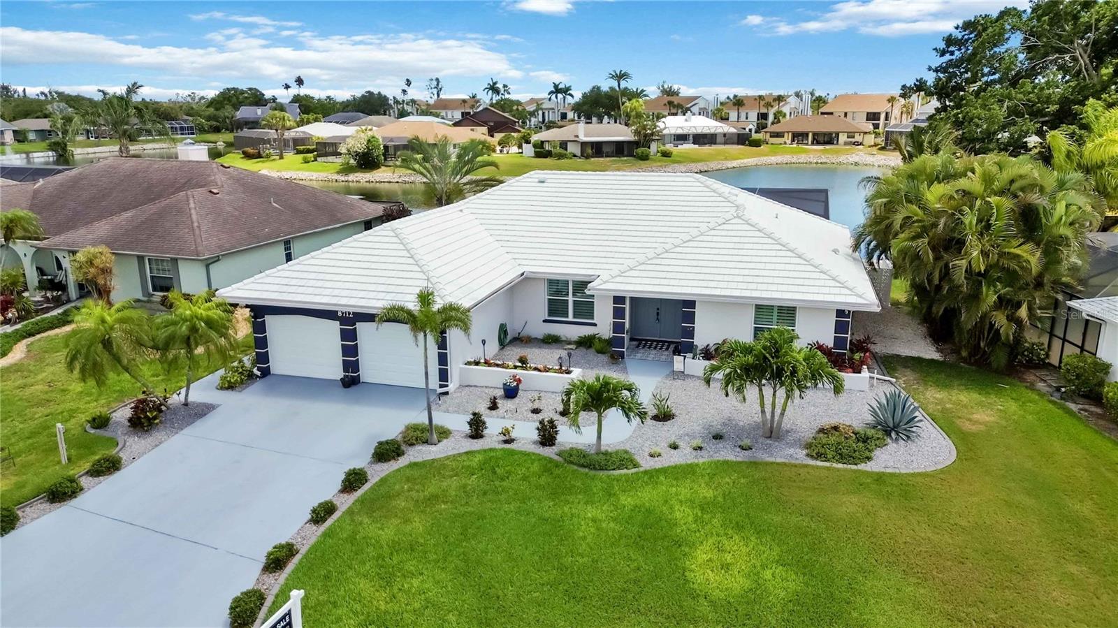 Welcome to this beautiful Bay Lakes Estates home—where every detail has already been handled.

This fully remodeled 3-bedroom, 3-bathroom, 2-car garage home is the definition of move-in ready… without a single compromise. No stone has been left unturned, every surface has been thoughtfully updated, from the flooring and bathrooms to the fresh, modern interior and exterior paint. The level of care, cleanliness, and attention to detail is immediately evident the moment you arrive.

From the moment you walk through the door, your eye is drawn straight through the expansive impact sliders to a stunning outdoor scene—your private heated pool and spa overlooking a serene pond with a tranquil water feature. It’s the kind of view that instantly slows your pace.

Inside, vaulted ceilings and a cohesive, designer-inspired color palette create an elevated yet comfortable living space. The heart of the home is a show-stopping 19’3” kitchen peninsula, wrapped in elegant Bianco Cielo quartz, complemented by shaker cabinetry and Samsung appliances (2022)—perfect for entertaining or everyday luxury.

And then there’s the peace of mind, because the big-ticket items? Already done.

* New ductwork & variable speed HVAC (2024)
* Seawall replacement (2025, $73K) + enhanced waterfront landscaping
* Pool cage with full-view screen (2023, $29.5K), heated pool + spa, new pump (2026)
* Impact windows & sliders (2021)
* Luxury vinyl plank flooring throughout (2026, $20K)
* Tile roof replaced (2013), professionally pressure washed (04/2026), and upgraded with hurricane clips (03/2026)
* Exterior was painted, along with driveway & pool deck  (2026)

Even the neighborhood delivers—buried utilities (hello storm season peace of mind), plus HOA-covered lawn care, irrigation, and pond maintenance.

And when you’re ready to leave your private oasis? You’re just 3 miles from the sugar sand beaches of Anna Maria Island and Bradenton Beach.

This isn’t just updated, it’s complete.
All that’s left is for you to move in and start living.
Please check out the Matterport 3D walk through.