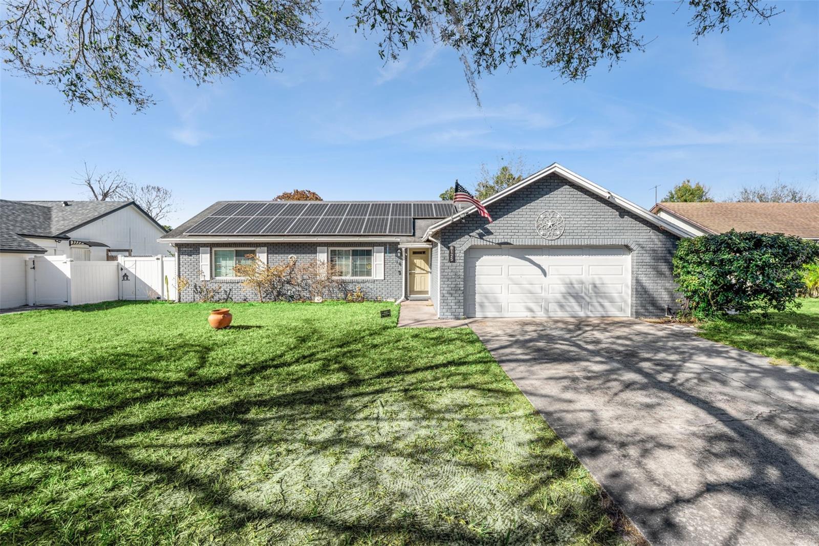 Welcome to your own private Florida retreat! This beautifully updated pool home offers the perfect blend of comfort, efficiency, and outdoor living. Inside, you'll find vaulted ceilings and an open-concept layout connecting the living, dining, and kitchen areas. The updated kitchen features white cabinetry, granite countertops, stainless steel appliances, a breakfast bar, and a center island—perfect for everyday living and entertaining.

Step outside through the updated sliding patio doors to your screened lanai, sparkling private pool, and freshly resurfaced pool deck, creating the ideal setting for relaxing or entertaining guests. The lush backyard provides a peaceful outdoor escape while the home's extensive improvements offer added peace of mind.

Major updates include a roof (2015), energy-efficient windows and front door (2018), solar panels installed in 2019 that will be paid off at closing, attic insulation and solar attic fan (2019), water heater (2019), garage door (2019), kitchen renovation (2020), sliding patio doors (2021), additional home improvements completed in 2024, and pool resurfacing with deck painting (2025).

Just minutes from Orlando International Airport, major highways, shopping, dining, and everyday conveniences.

Move-in ready, energy-efficient, and packed with updates—this is one you won't want to miss!